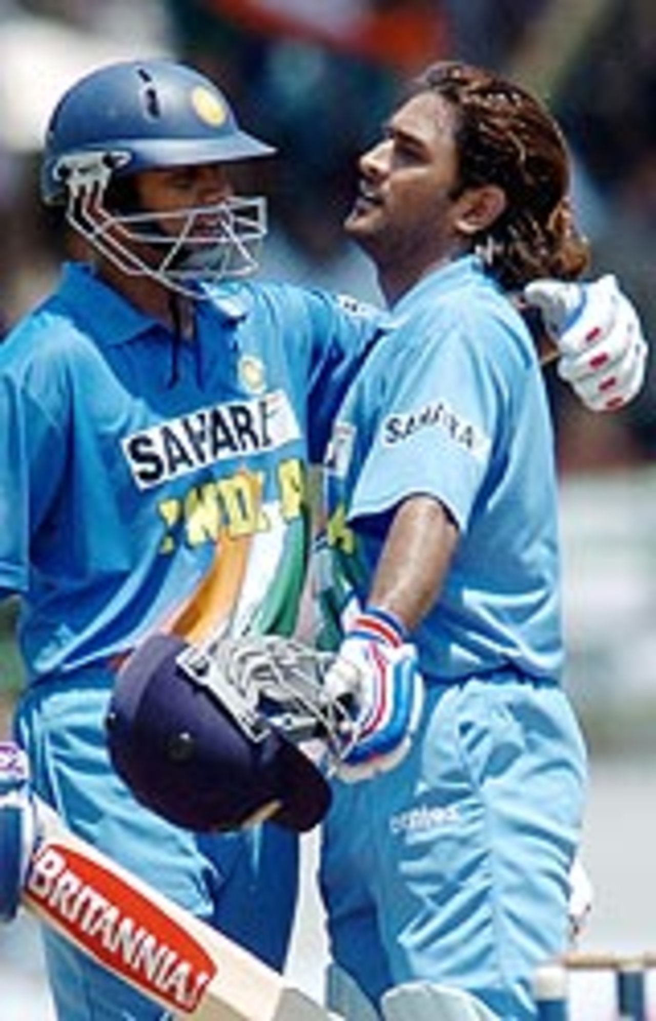 Mahendra Dhoni is congratulated by Rahul Dravid after completing his century, India v Pakistan, 2nd ODI, Visakhapatnam, April 5