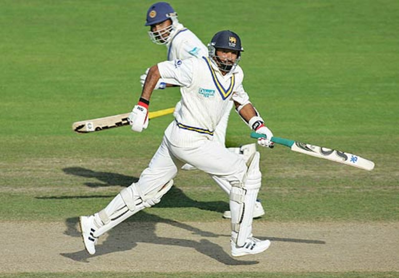 Marvan Atapattu and Mahela Jayawardene cross during their large stand, New Zealand v Sri Lanka, 1st Test, Napier, April 6, 2005
