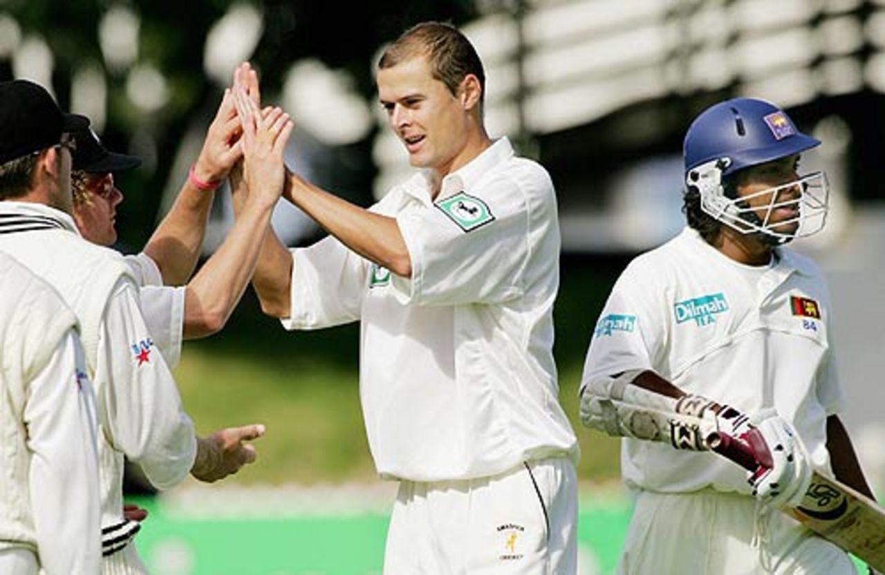 Chris Martin is congratulated after snapping up Kumar Sangakkara, New Zealand v Sri Lanka, 2nd Test, Wellington, 1st day, April 11, 2005