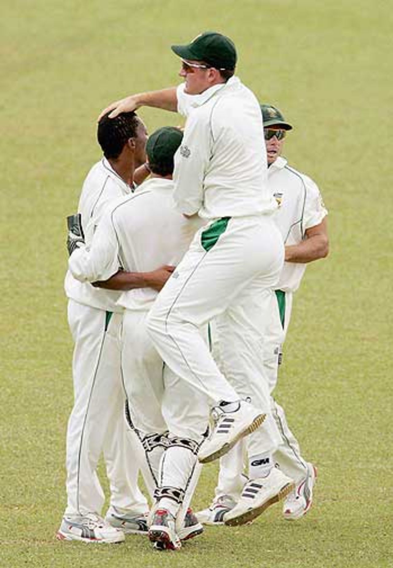South Africa celebrate the dismissal of Chris Gayle, as West Indies stumble against South Africa at Trinidad, April 11, 2005