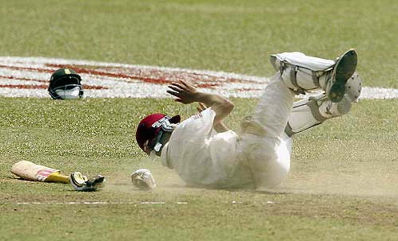 Ramnaresh Sarwan dives for his crease, as West Indies stumble against South Africa at Trinidad, April 11, 2005