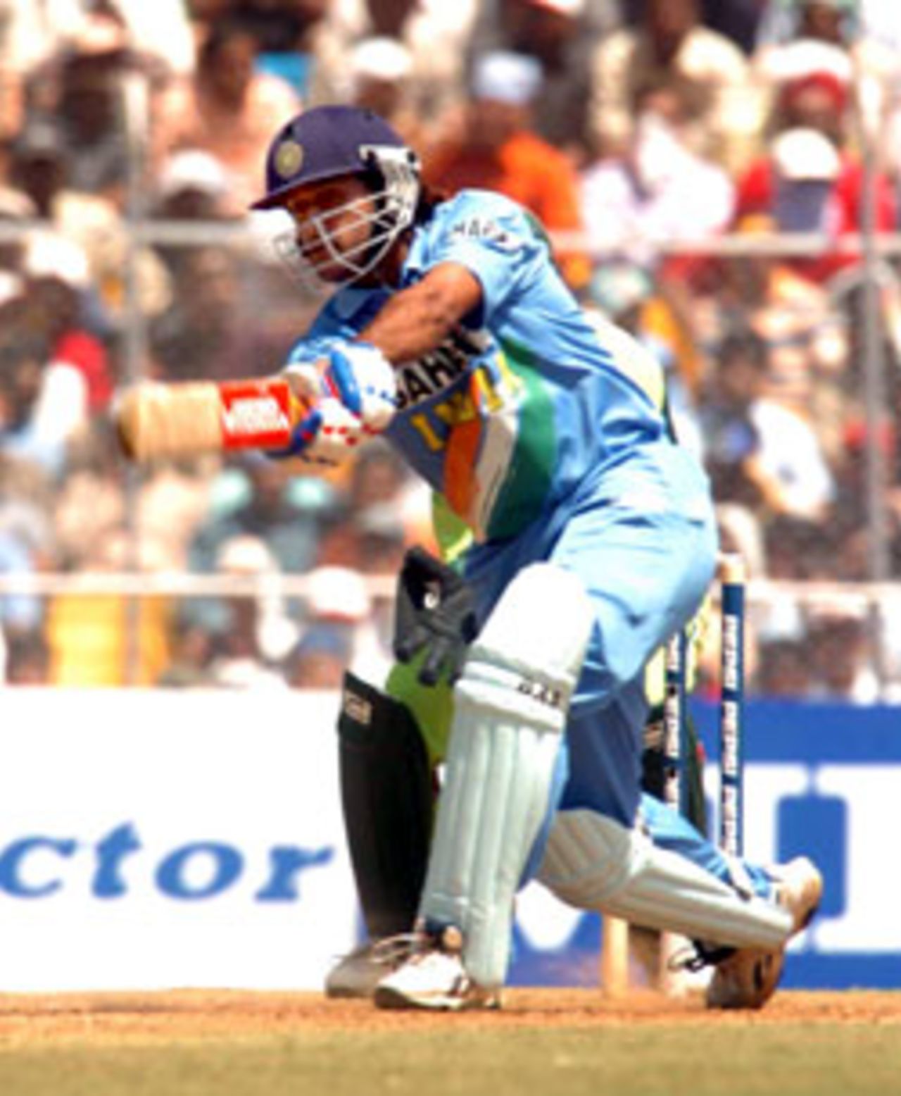 After Sehwag's dismissal, one wondered if India would lose the momentum generated by the two openers - However, Indian cricket's new poster boy, Mahendra Singh Dhoni, played what could be termed a 'perfect innings' under the circumstances - rotating the strike at every given opportunity, and scoring the occasional boundary., India v Pakistan, 4th ODI, Ahmedabad, April 12, 2005