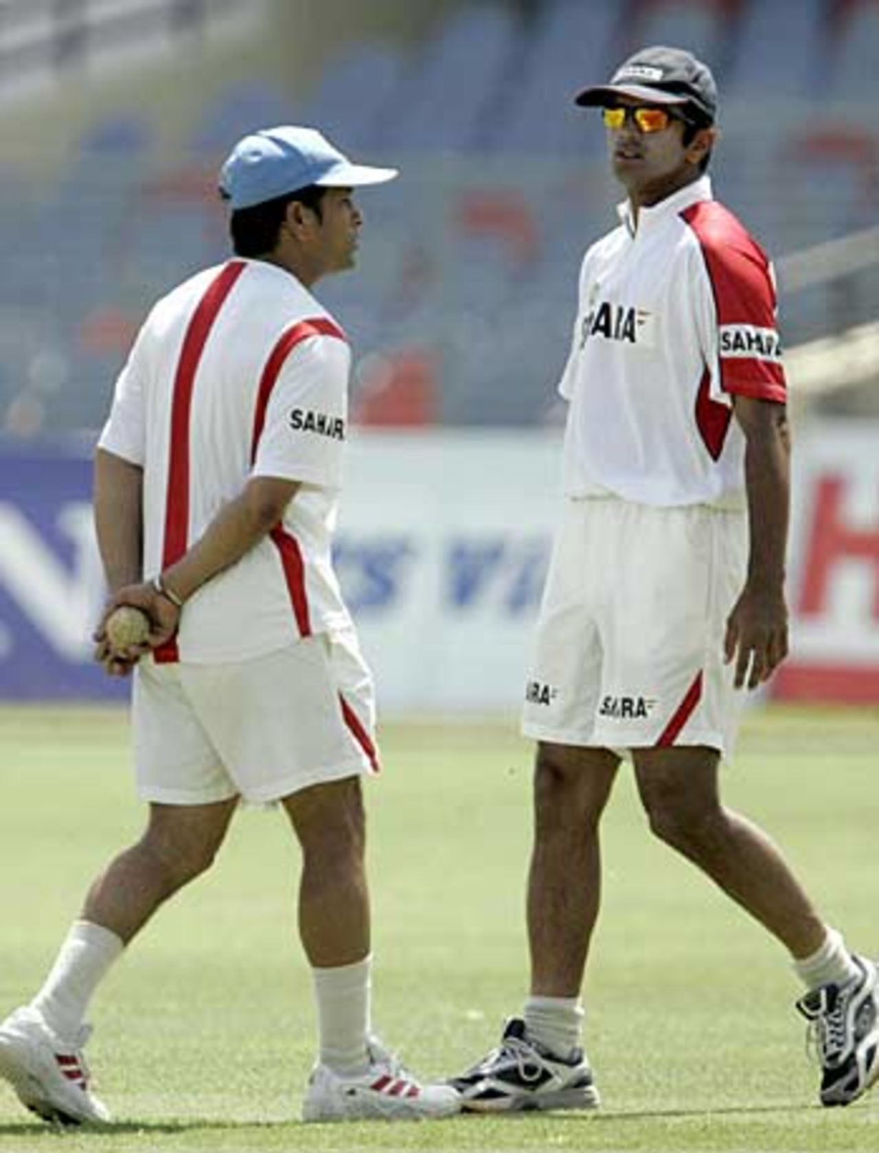 Sachin Tendulkar and Rahul Dravid chat during a training session, Kanpur, April 14, 2005