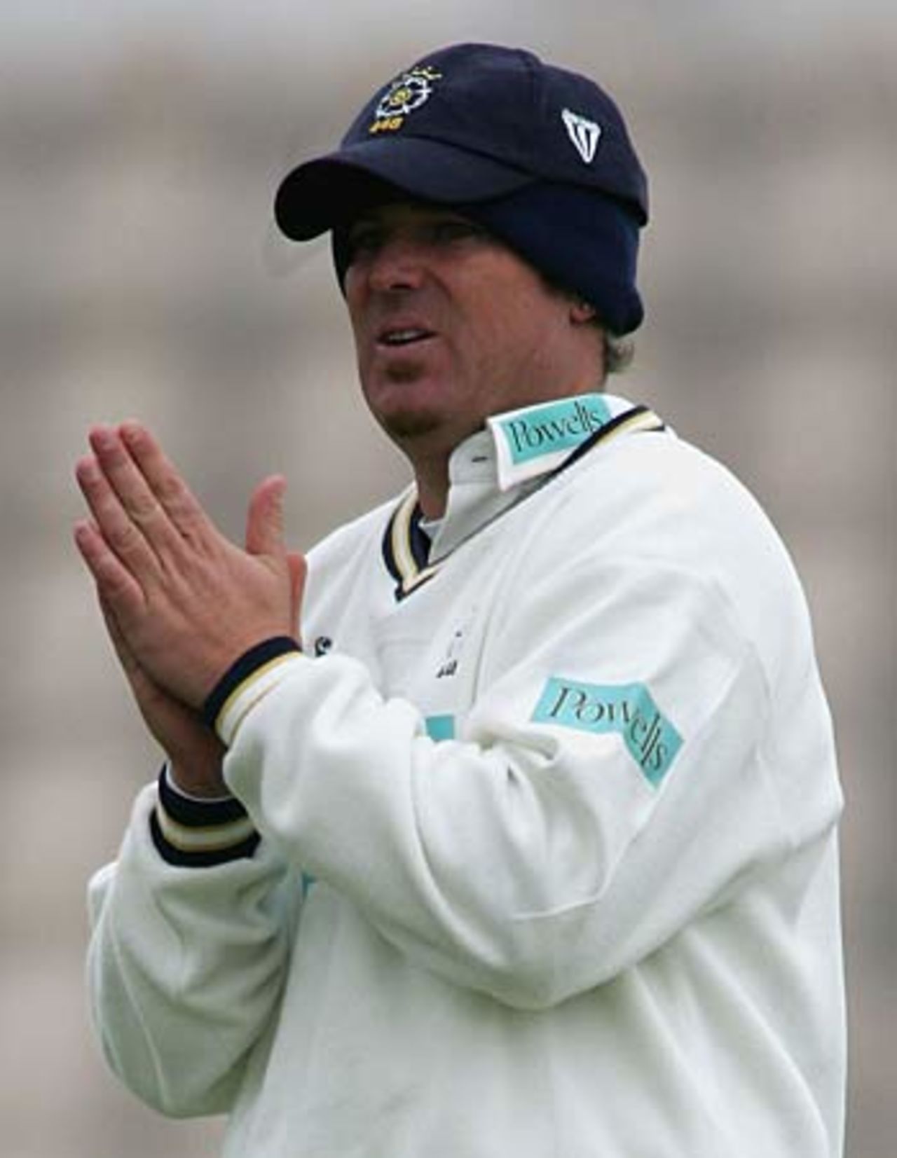 Praying for warmer weather ... Shane Warne feels the cold, Hampshire v Gloucestershire, Southampton, April 15, 2005