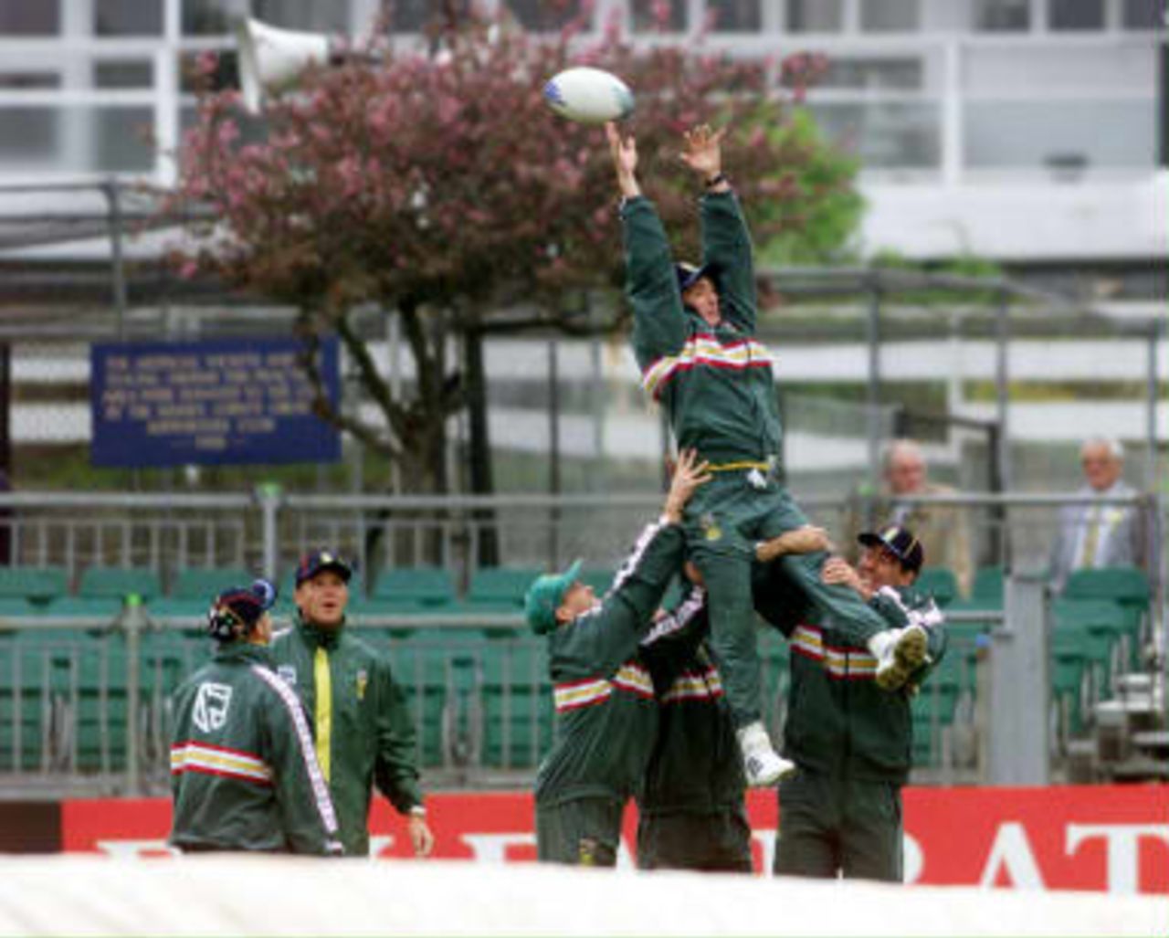 Alan Dawson gets a lift from team mates as they practise their rugby skills - abandoned Sussex - South Africa World Cup warm up match  07 May 1999
