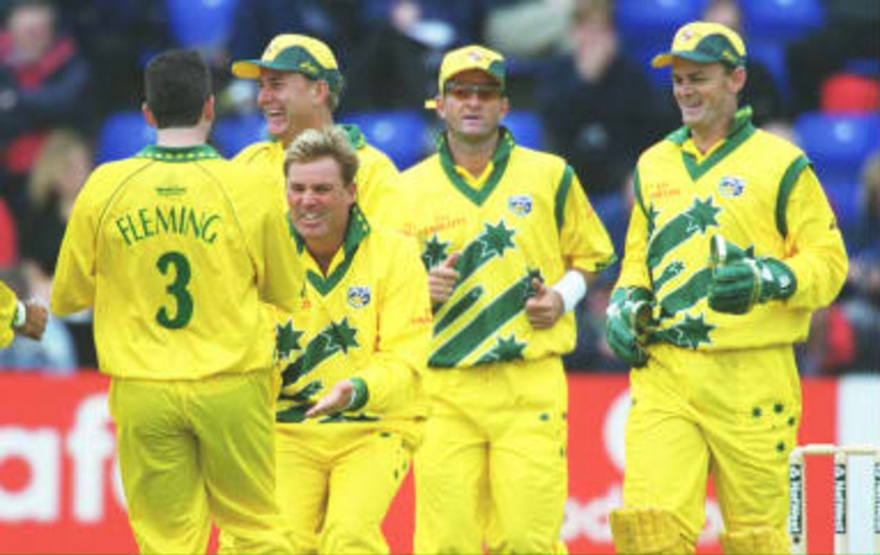 Shane Warne celebrates after catching Adrian Dale - World Cup warm-up game, Australia v Glamorgan in Cardiff, 08 May 1999.