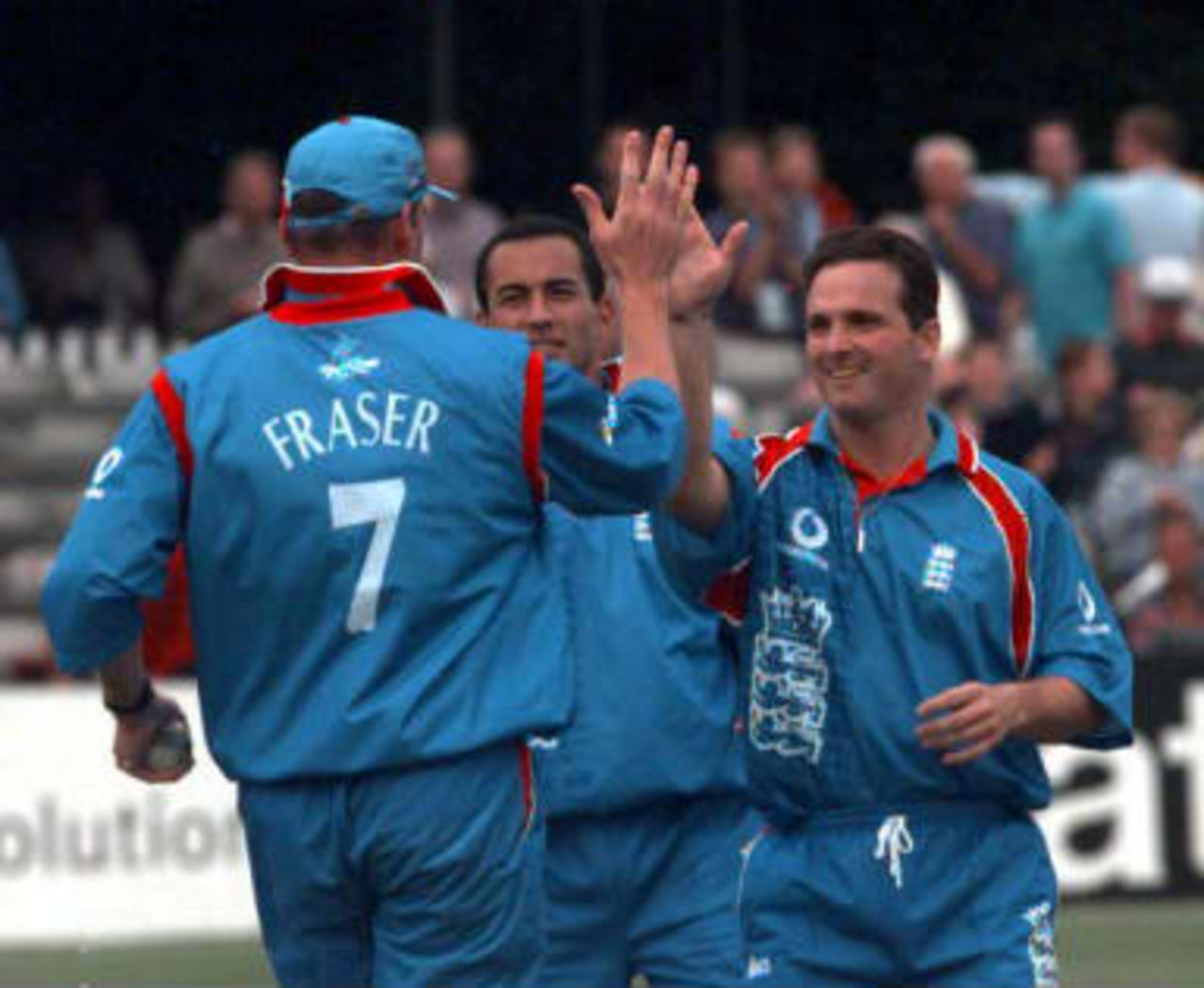 Angus Fraser high fives team mate Mark Ealham  after taking the wicket of Essex batsman  Law - World Cup warm-up match, England v Essex, Chelmsford, Essex, 09 May 1999.