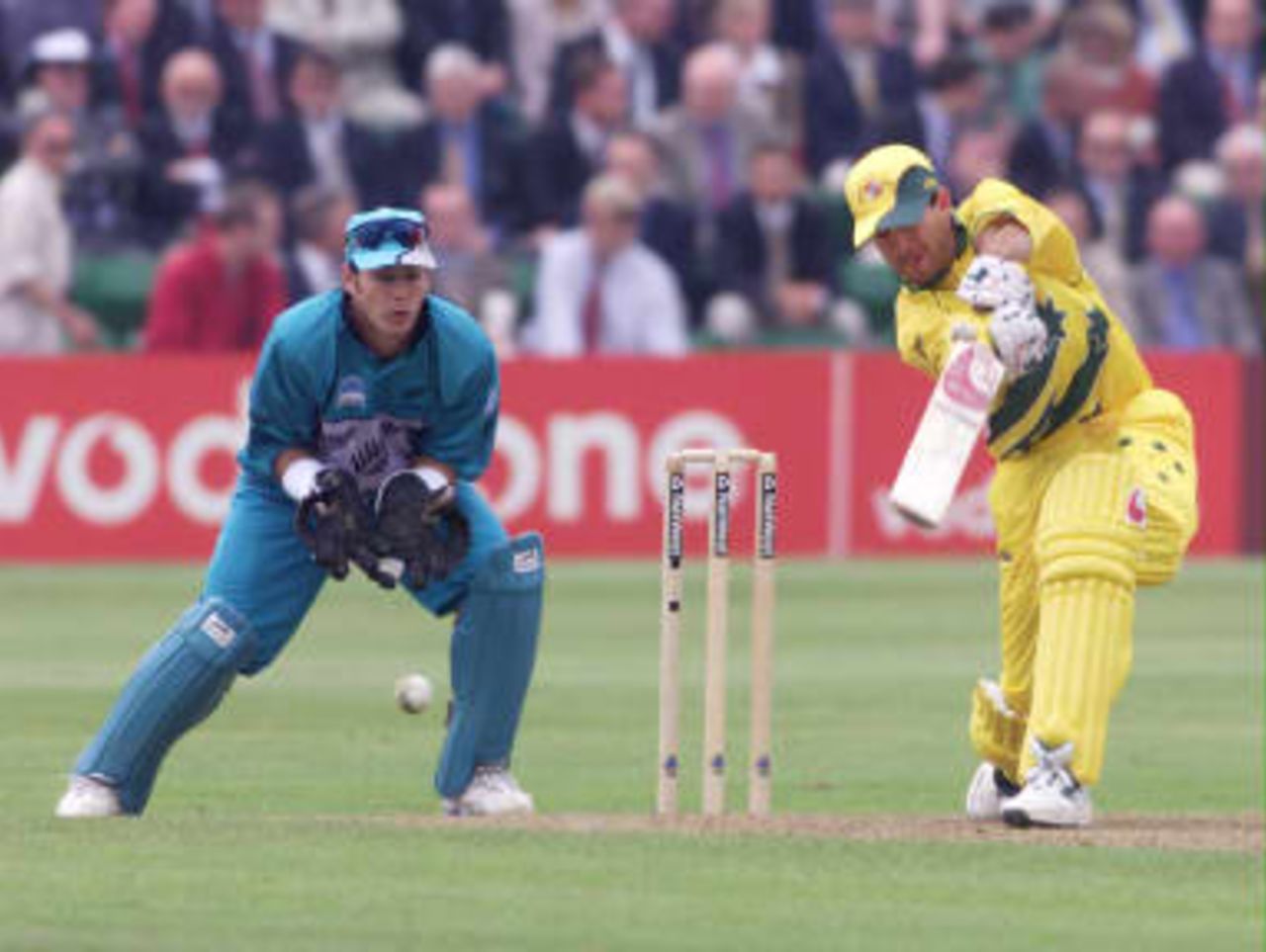 Australia's Ricky Ponting drives the bowling of New Zealand's Chris Harris 20 May 1999, with Adam Parore keeping wicket.