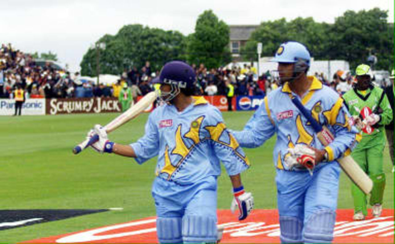 India's batsman Sachin Tendulkar (L) is congratulated by Rahul Dravid (R) after Tendulkar reached 140 not out against Kenya 23 May 1999 during their World Cup match in Bristol