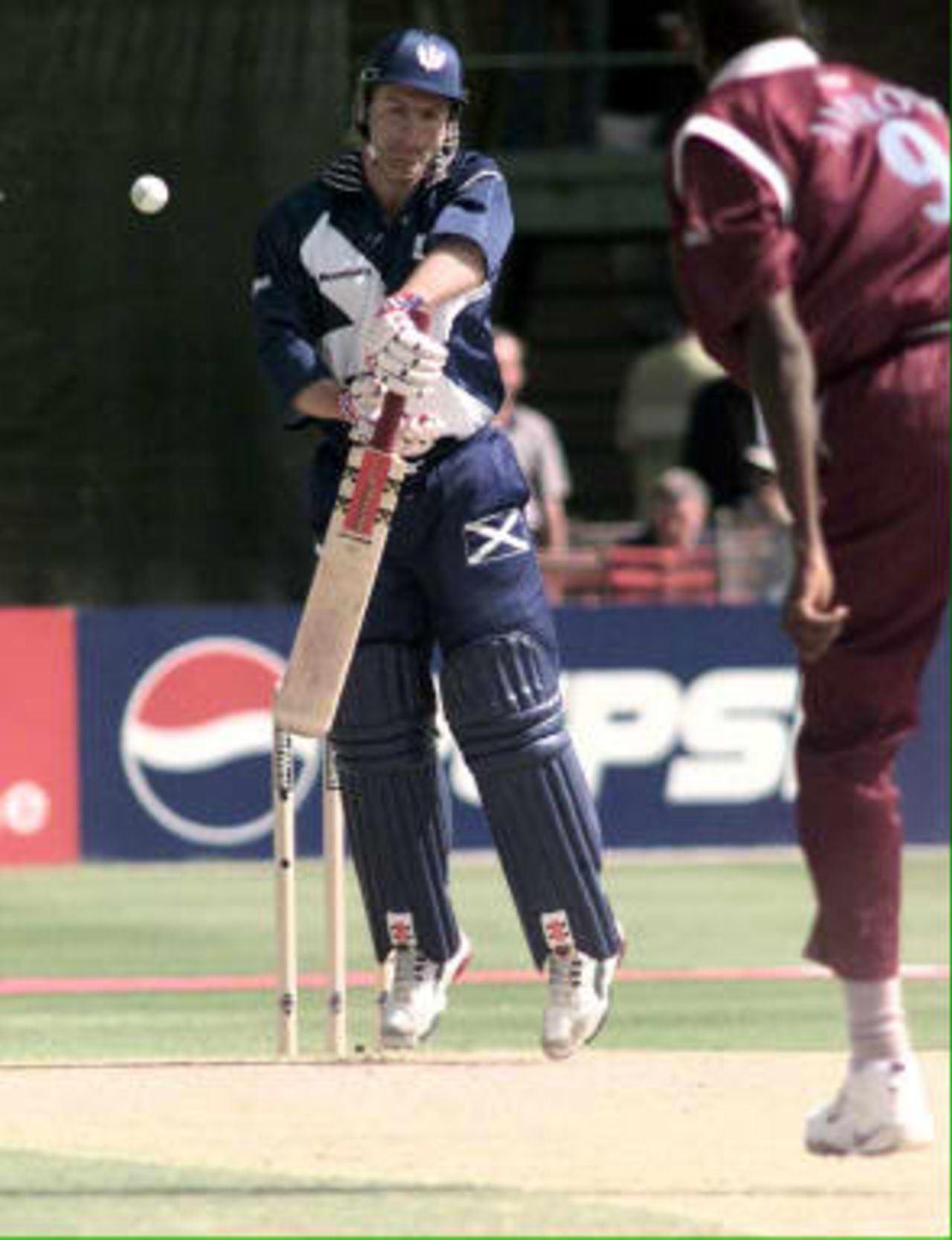 Scotland's Mike Smith evades the first bouncer of the day from Curtly Ambrose during their Cricket World Cup match against the West Indies at Grace Road in Leicester, 27 May 1999
