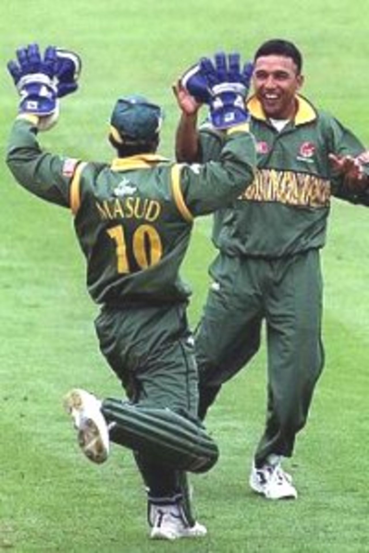 31 May 1999: Shafiuddin Ahmed of Bangladesh celebrates the wicket of Ijaz Ahmed of Pakistan with wicketkeeper Khaled Masud during the match between Pakistan and Bangladesh in Group B of the Cricket World Cup at the County ground, Northampton. Mandatory Credit: Ross Kinnaird/ALLSPORT