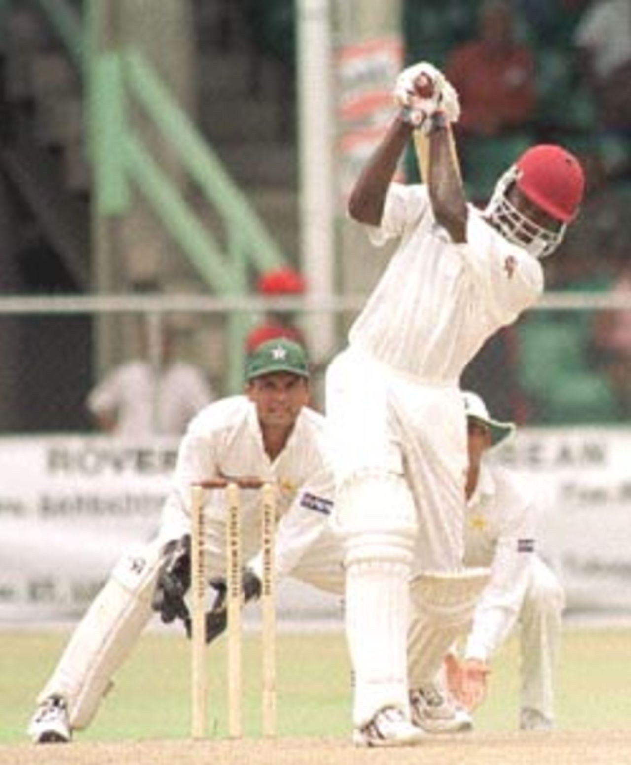 West Indies batsman Wavell Hinds drives Pakistani bowler Mushtaq Ahmed on the second day of the second Cable & Wireless Test at Kensington Oval in the Barbados, 19 May, 2000. Pakistan in West Indies, West Indies v Pakistan  (18-22 May 2000) Day 2