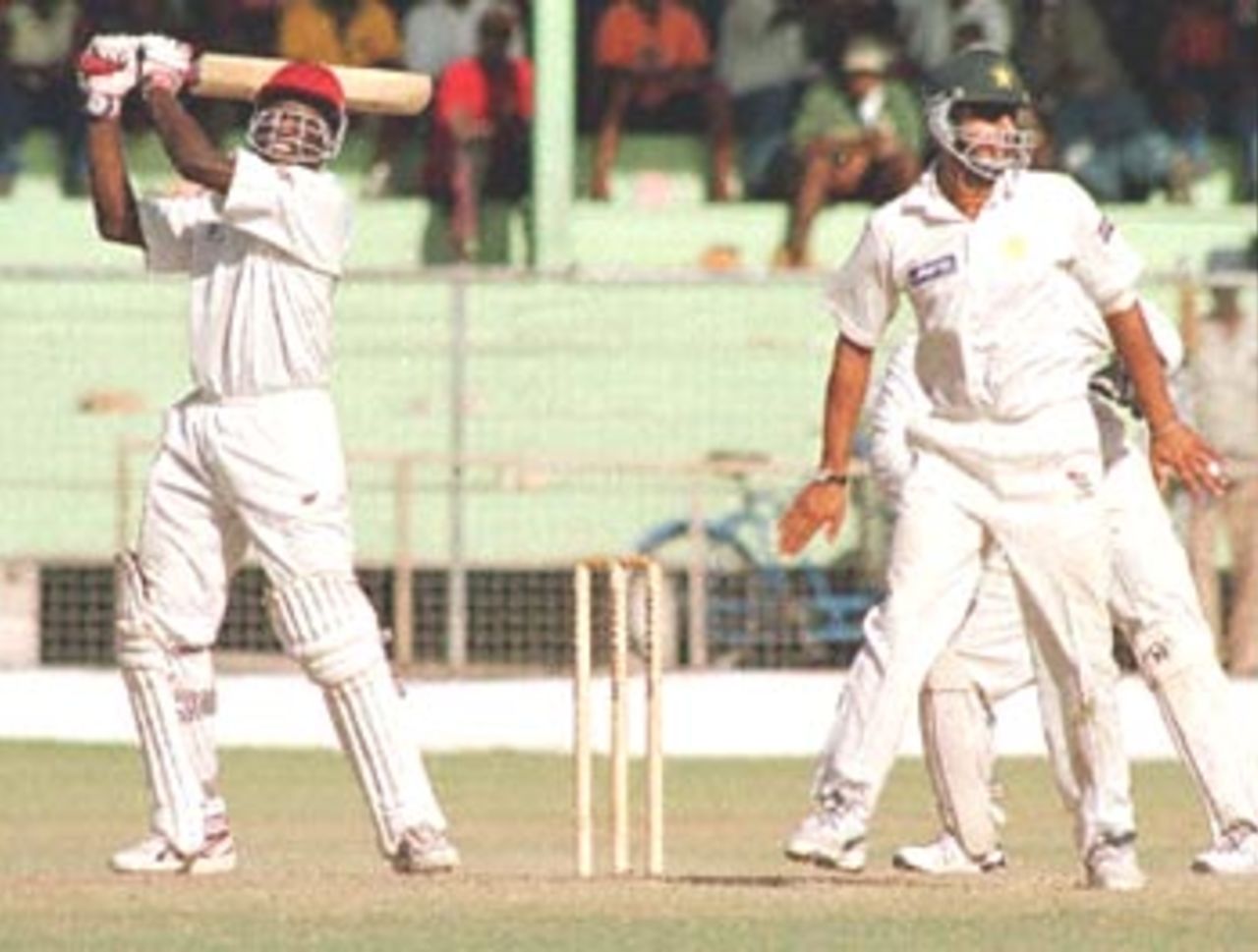 West Indies batsman Wavell Hinds (L) lifts Mustaq Ahmed of Pakistan for four in the final day of the second Cable & Wireless test at Kensington Oval in Bridgetown, Barbados, 22 May, 2000. Pakistan in West Indies, West Indies v Pakistan (18-22 May 2000) Day 5
