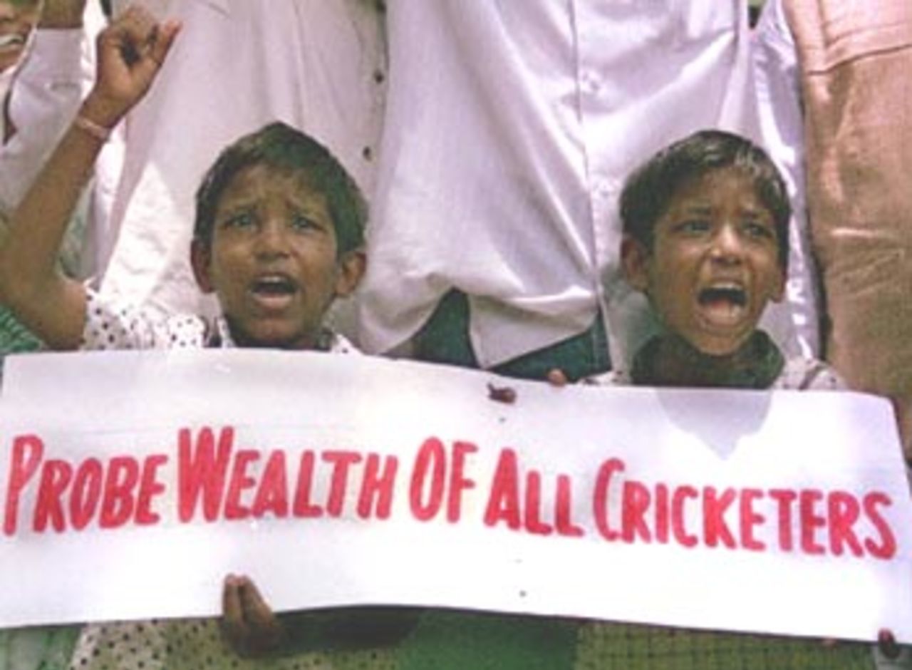 Two young cricket fans joined the Citizen Organisation for Public Opinion at a demonstration in Bombay, 26 May 2000, about the allegations made against Kapil Dev and other members of the Indian cricket team, which has brought disgrace upon the Indian nation. Protestors demanded all Indian cricket players be banned from International matches, until the issue has been sloved.