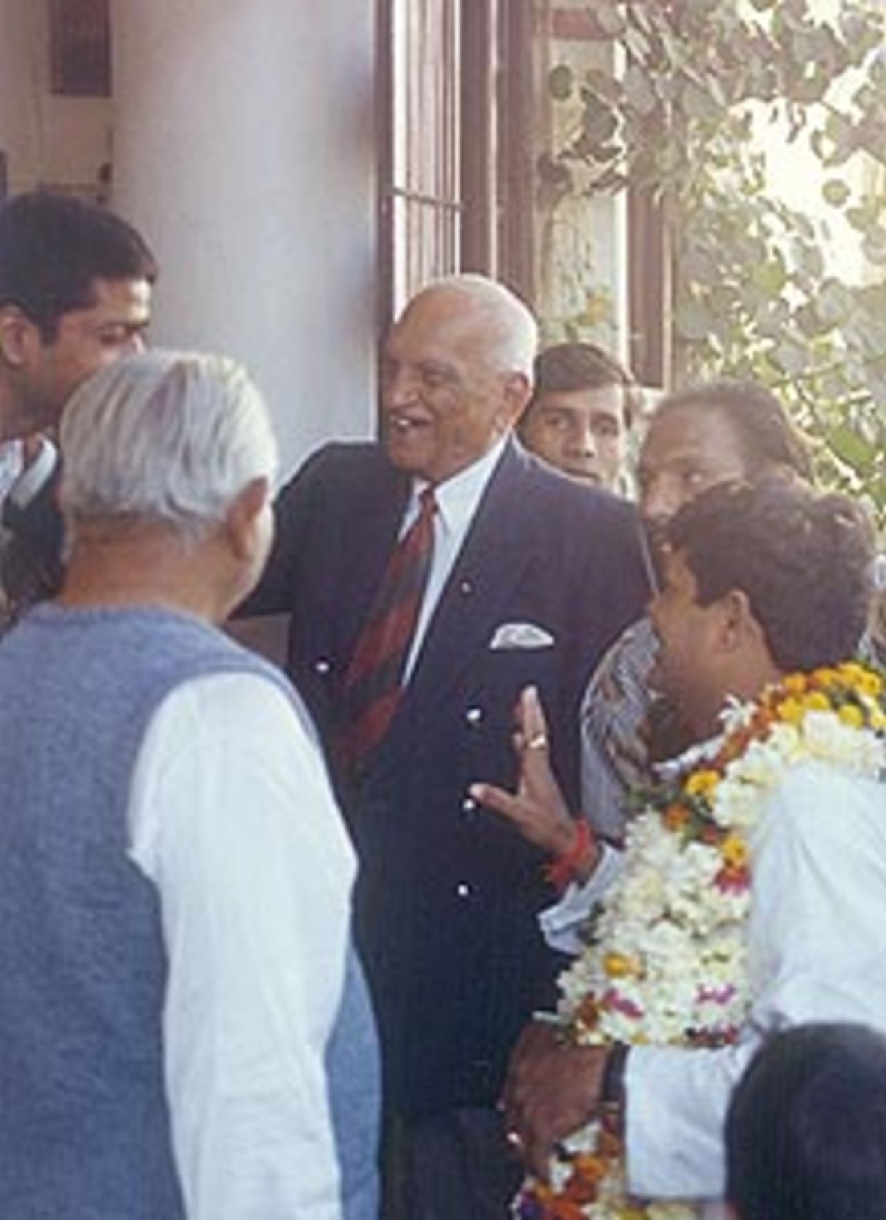 Mushtaq Ali shares a lighter moment with his guests, Indore, December 1999