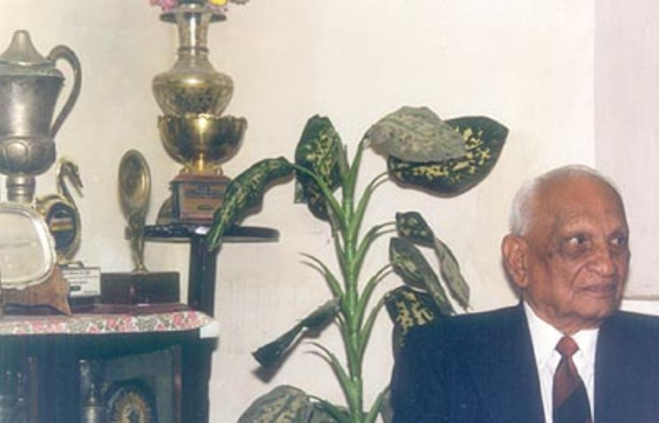 Mushtaq Ali in front of his trophy cabinet, Indore, December 1999
