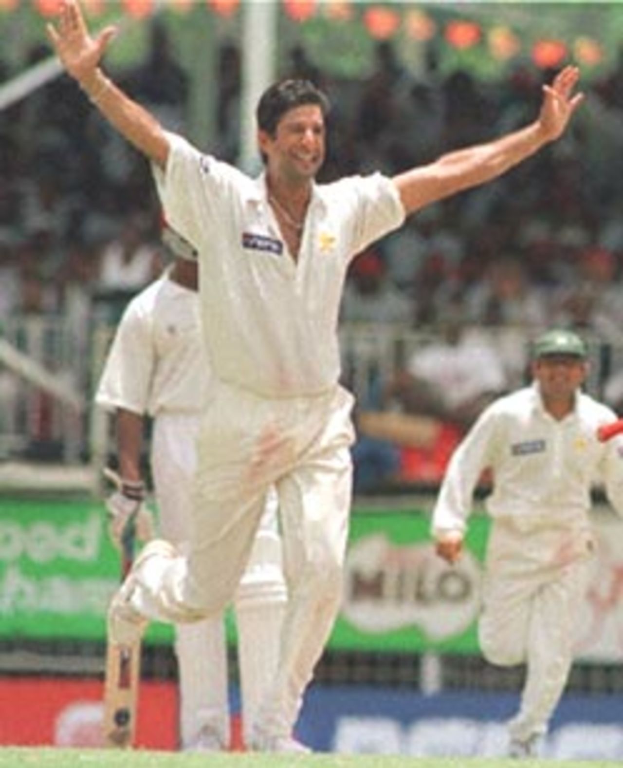 Pakistani bowler W. Akram celebrates after taking his fifth wicket 27 May, 2000, during the third day of the third and deciding test at Antigua. Pakistan in West Indies 1999/00, 3rd Test, West Indies v Pakistan, Antigua Recreation Ground, St John's, Antigua, (25-29 May 2000) Day 3