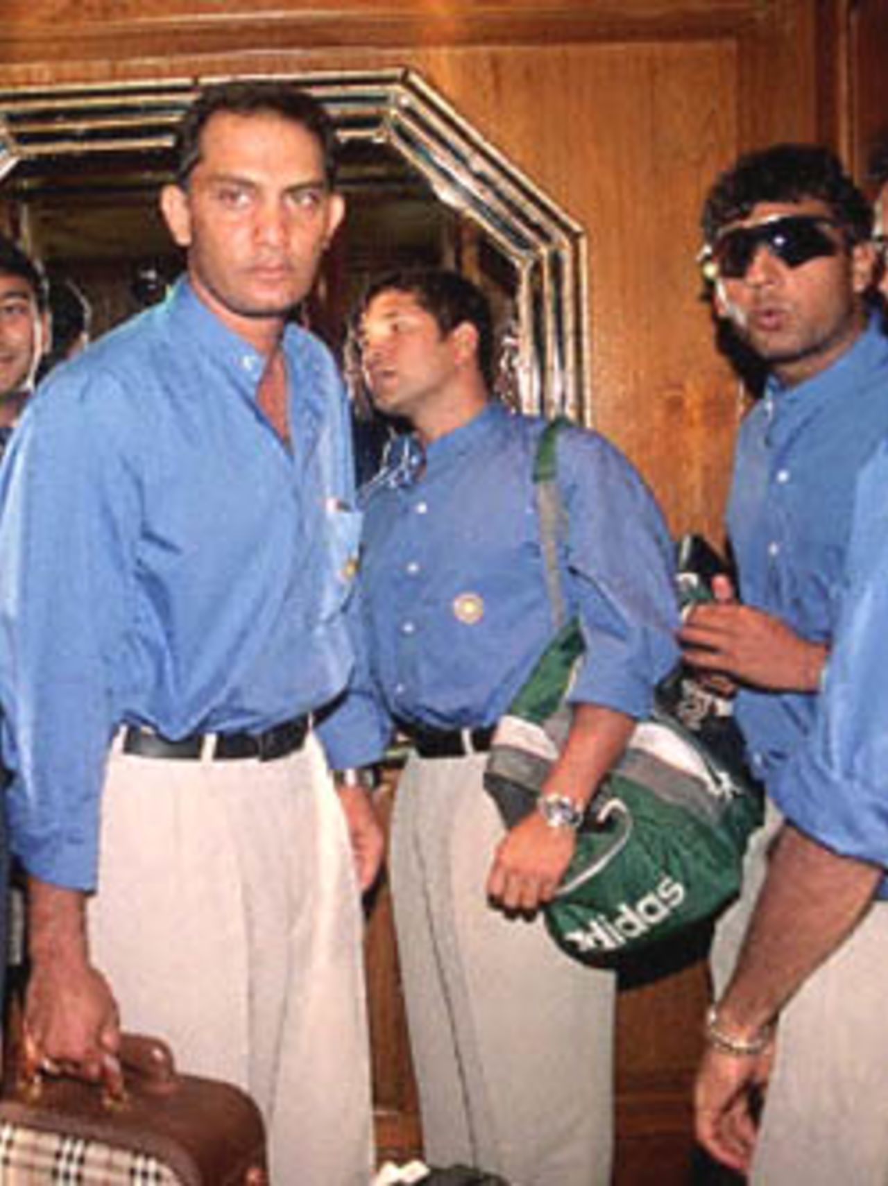 Indian cricket stars (L to R) Mohammad Azharuddin,Sachin Tendulkar and Ajay Jadeja (sun glass) on arrival at Dhaka's Sheraton Hotel 28 May 2000,after a flight from New Delhi to play in the rain-hit four-nation Asia Cup cricket.Incessant rain disrupted the start of the 10-day limited-overs tournament on Sunday amid fears the entire event may be washed out.Besides India and host Bangladesh the Asia Cup include Sri Lanka and Pakistan.
