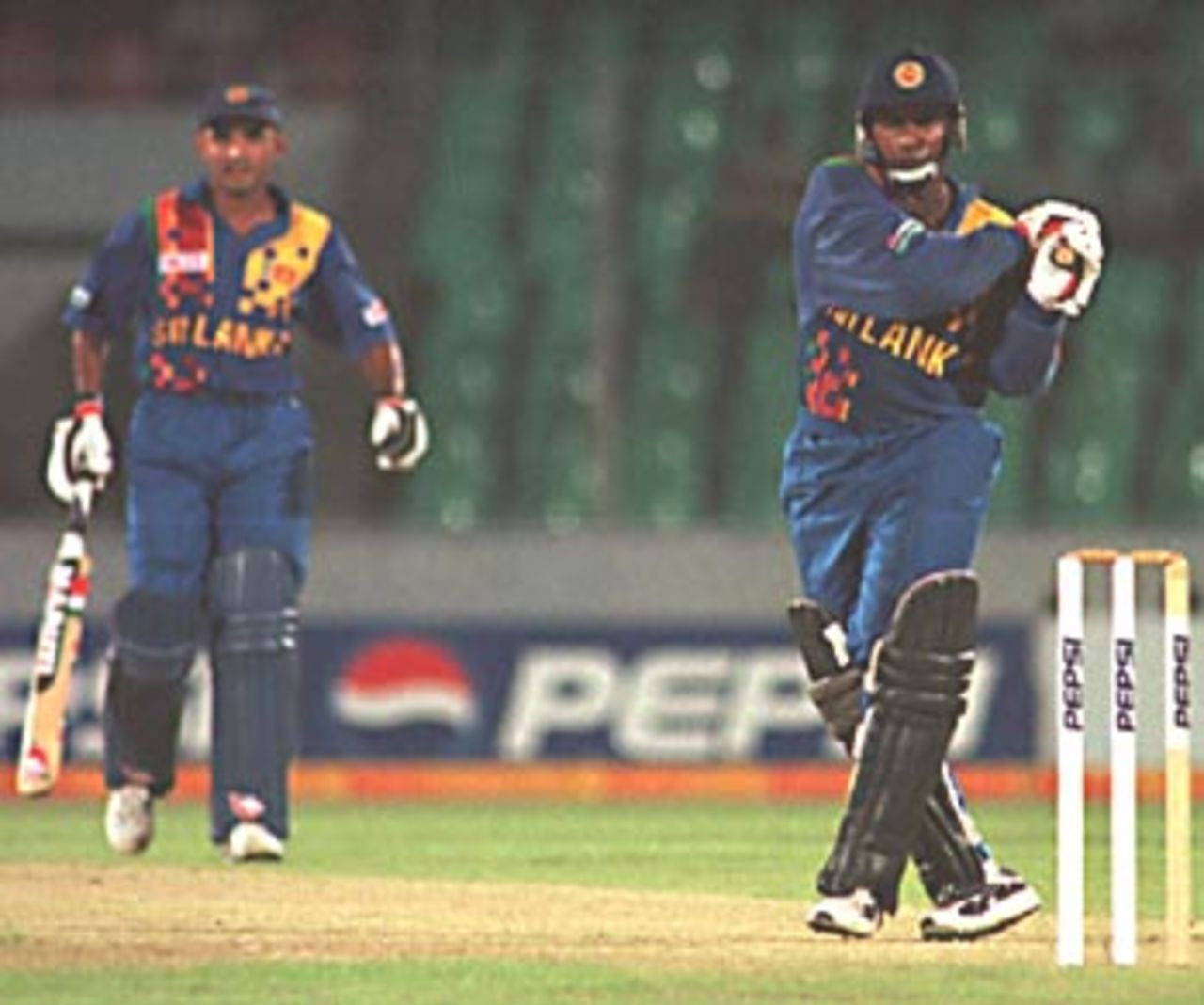 Aravinda de Silva smashing the ball through fine leg while his partner Atapattu watching on, Asia Cup 1999/00, Bangladesh v Sri Lanka, Bangabandhu National Stadium, Dhaka 29 May 2000