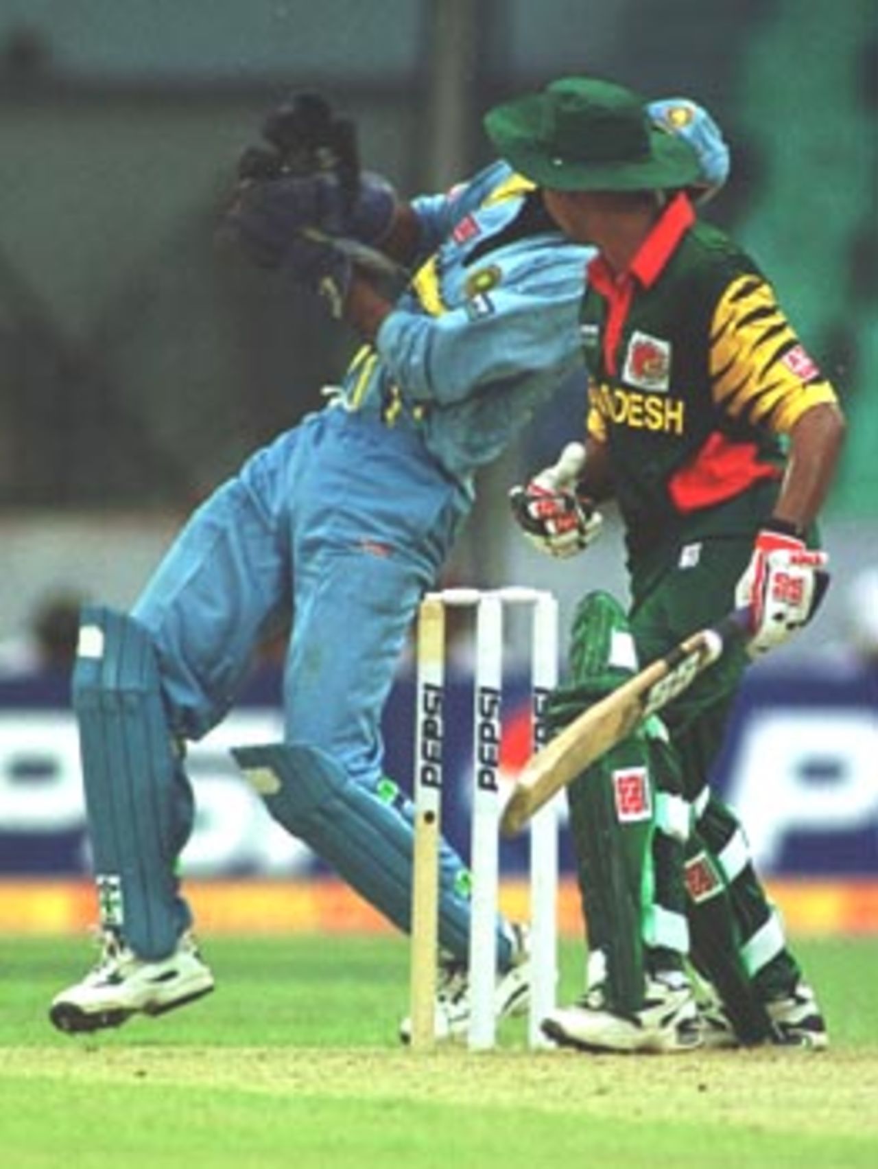 Keeper Karim gets hit by a Kumble delivery, Asia Cup 1999/00, 2nd Match, Bangladesh v India, Bangabandhu National Stadium, Dhaka. 30 May 2000
