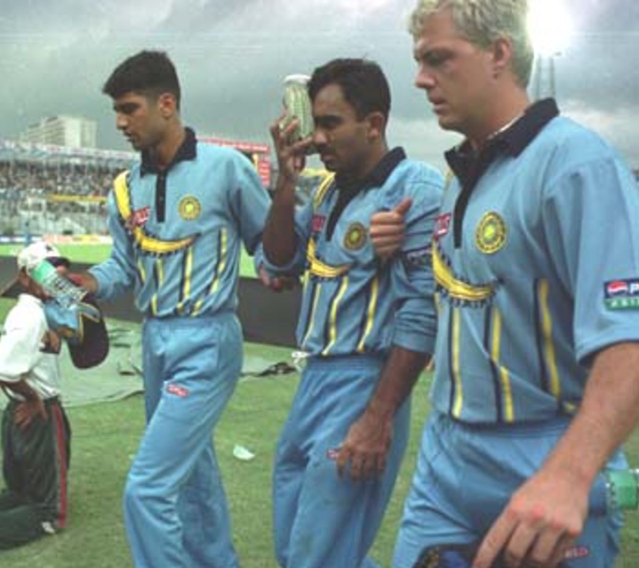 The injured Karim being led off the field, Asia Cup 1999/00, 2nd Match, Bangladesh v India, Bangabandhu National Stadium, Dhaka 30 May 2000
