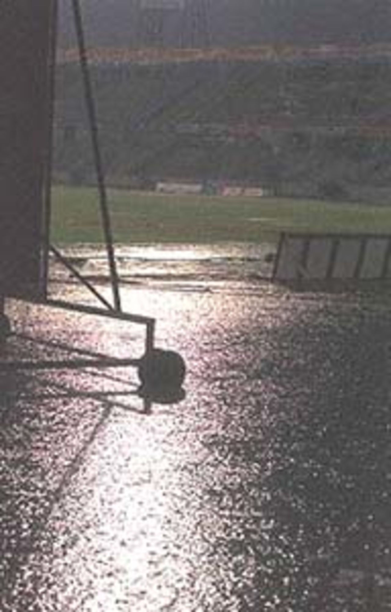 The pitch of the Bangabandhu National stadium in Dhaka lies inundated with water after rain washed out the Asia Cup limited-overs international between India and Bangladesh 30 May 2000. The match will resume 31 May with Bangladesh on 98 for two in 25.2 overs.