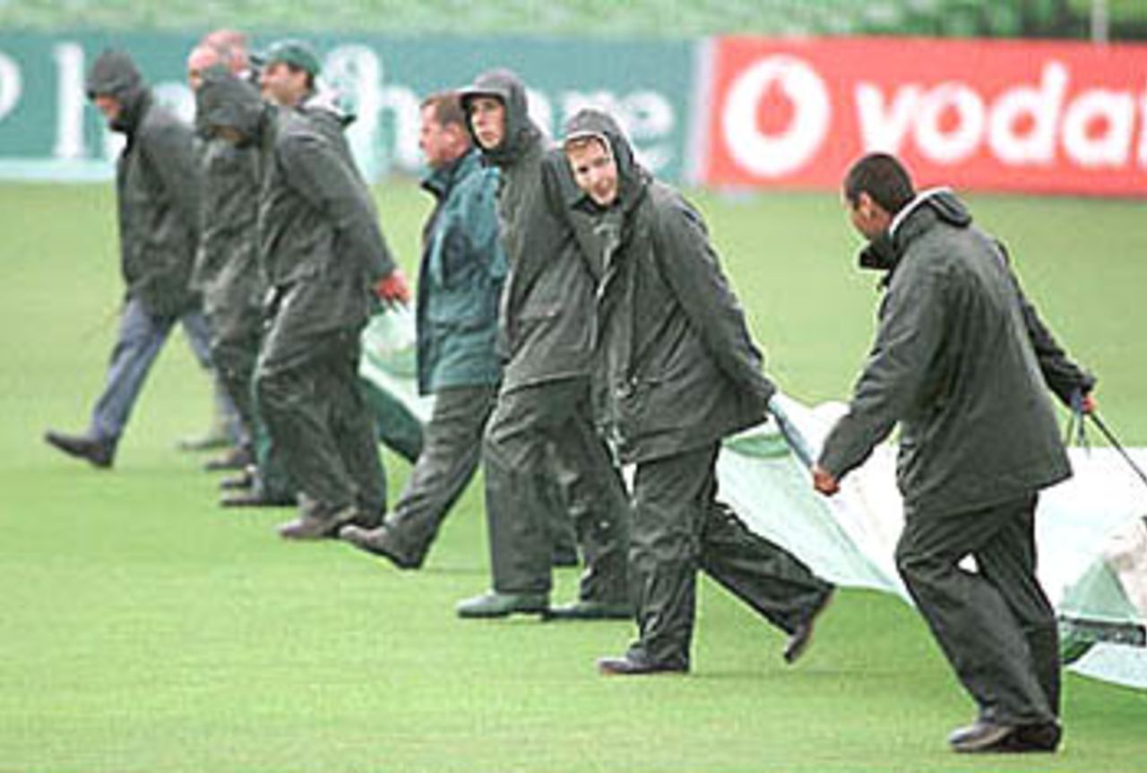 Kent ground staff busy with the covers, PPP healthcare County Championship Division One, 2000, Kent v Lancashire, St Lawrence Ground, Canterbury, 26-29 Apr 2000.