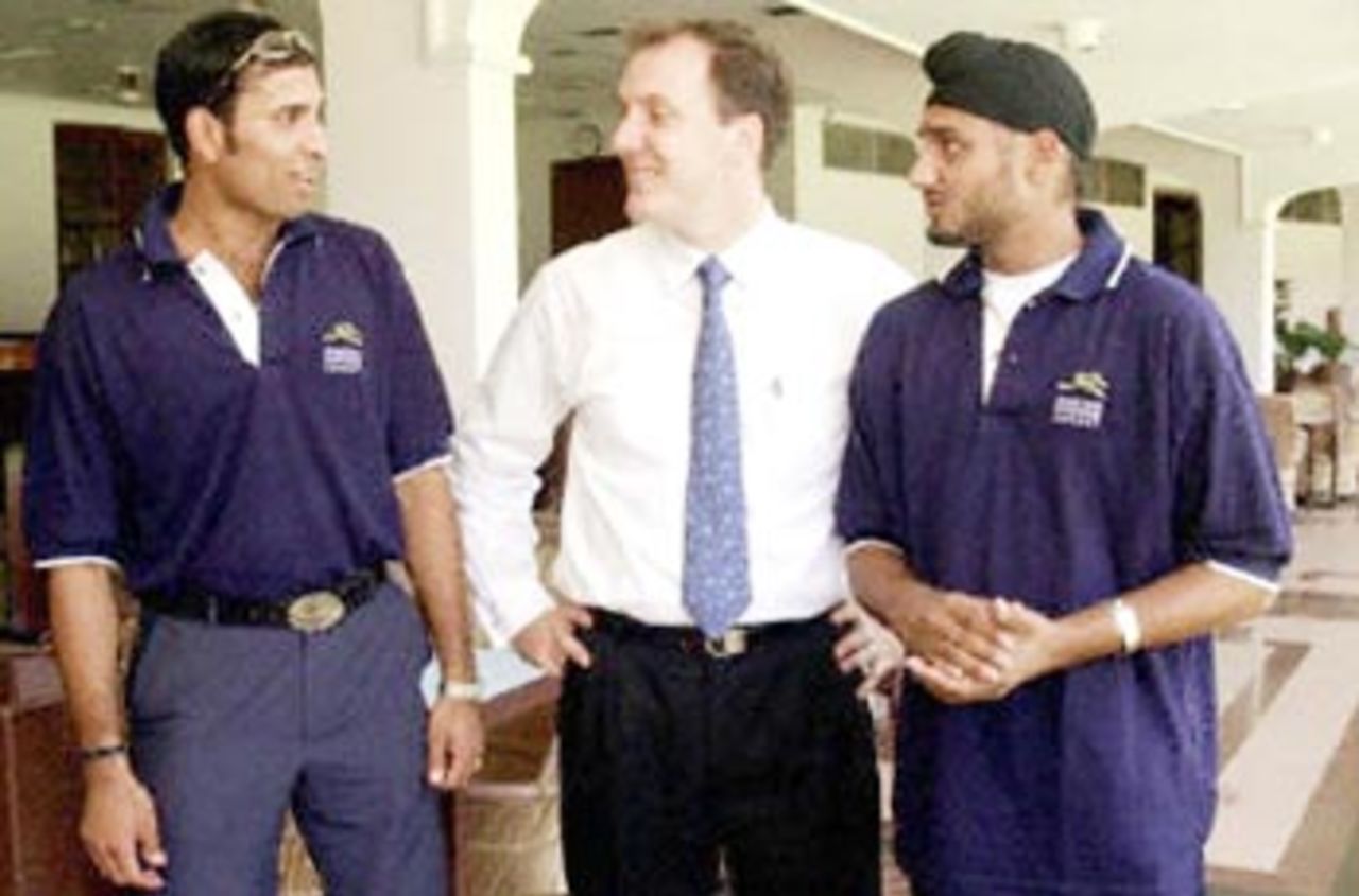 New Indian cricket sensations V.V.S Laxman (L) and Harbhajan Singh (R) share a joke with Sporting Frontiers Managing Director Neil Maxwell (C) following a press conference at the Cricket Club of India in Bombay 04 May 2001. Singh and Laxman were signed up by the global sport, entertainemnt and leisure business company for the next three years