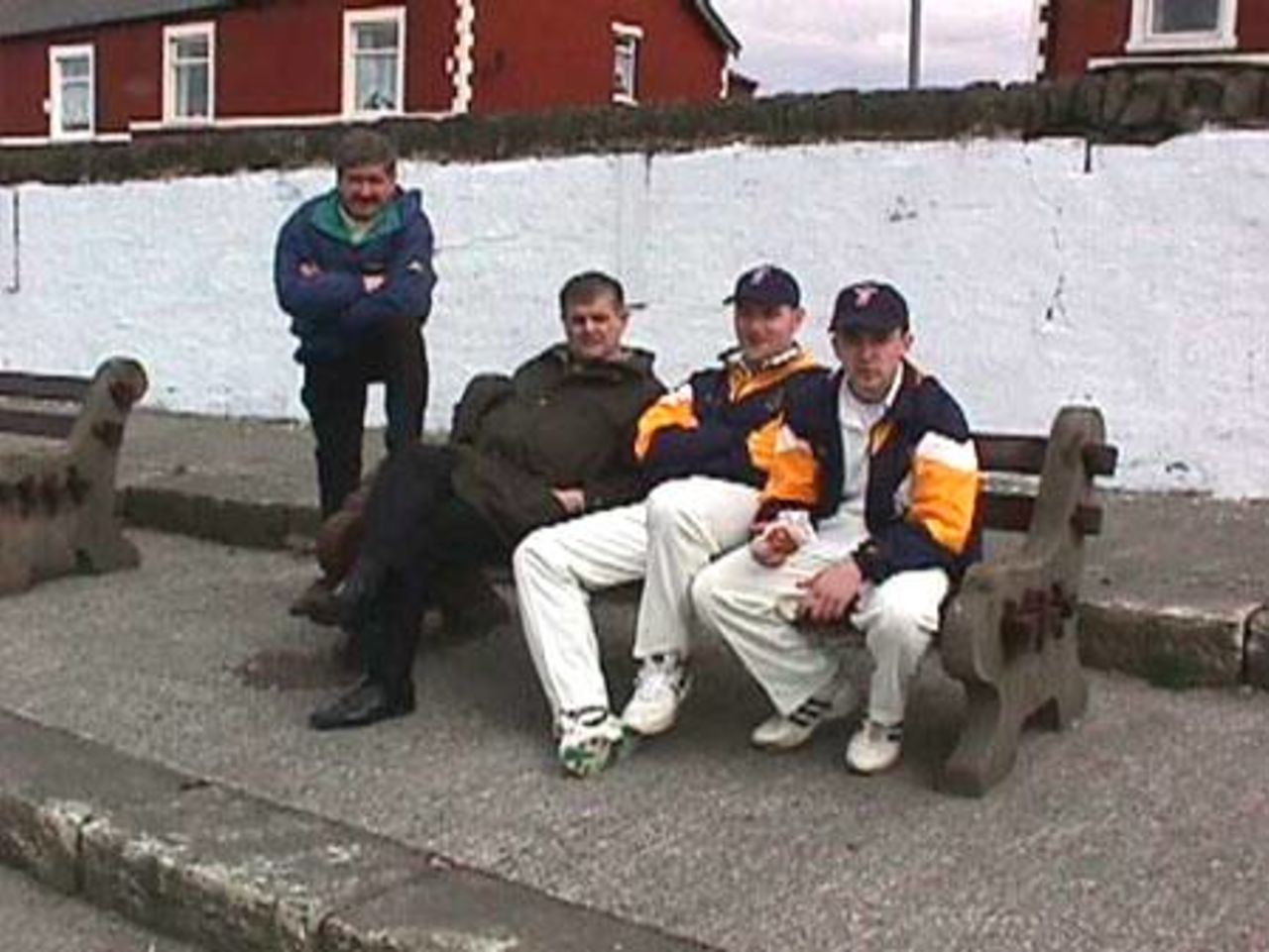 Players past and present chat during the match