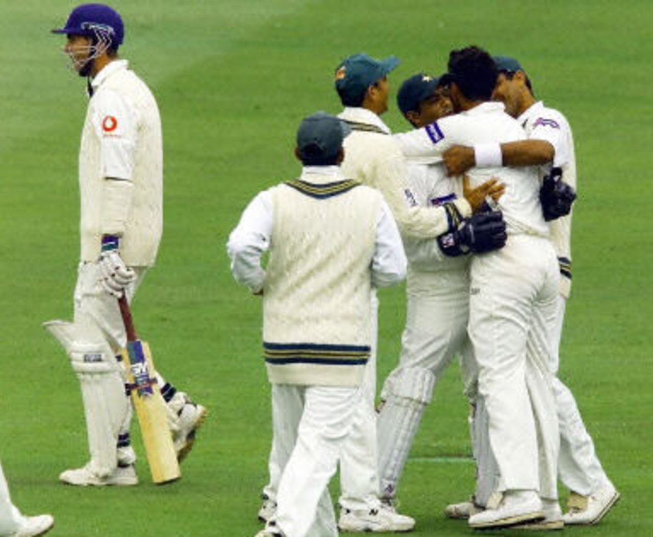 Rashid Latif hugs Azhar after Vaughan is caught behind, day 2, 1st Test at Lord's, 17-21 May 2001.