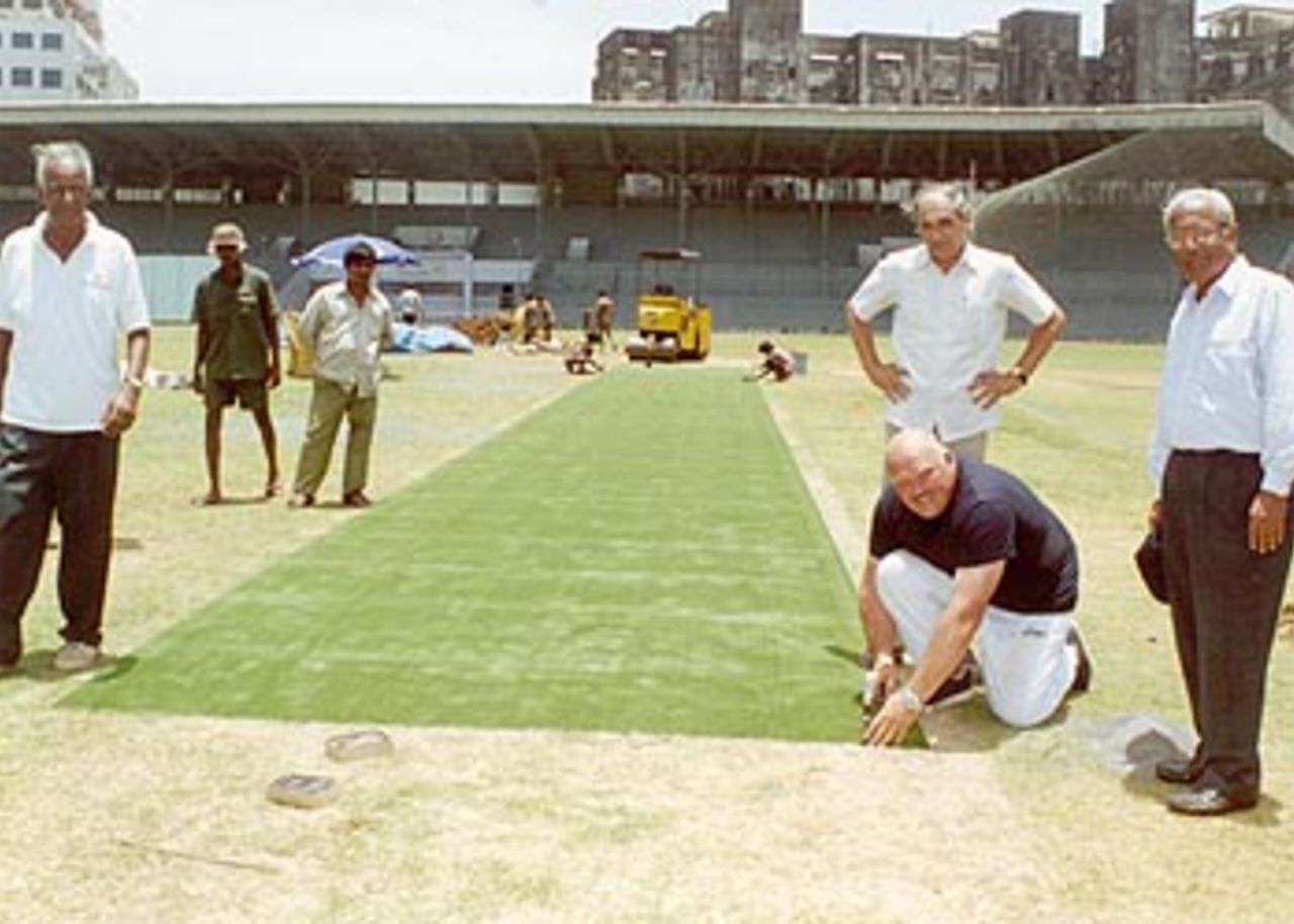25 May 2001: John Tatter unrolls India's first imported pitch at the Brabourne Stadium even as KD Kotwal (Chairman, CCI Cricket Sub-Committee) and former Test wicket keeper CT Patankar (Asst Secretary, Sports CCI) looks on