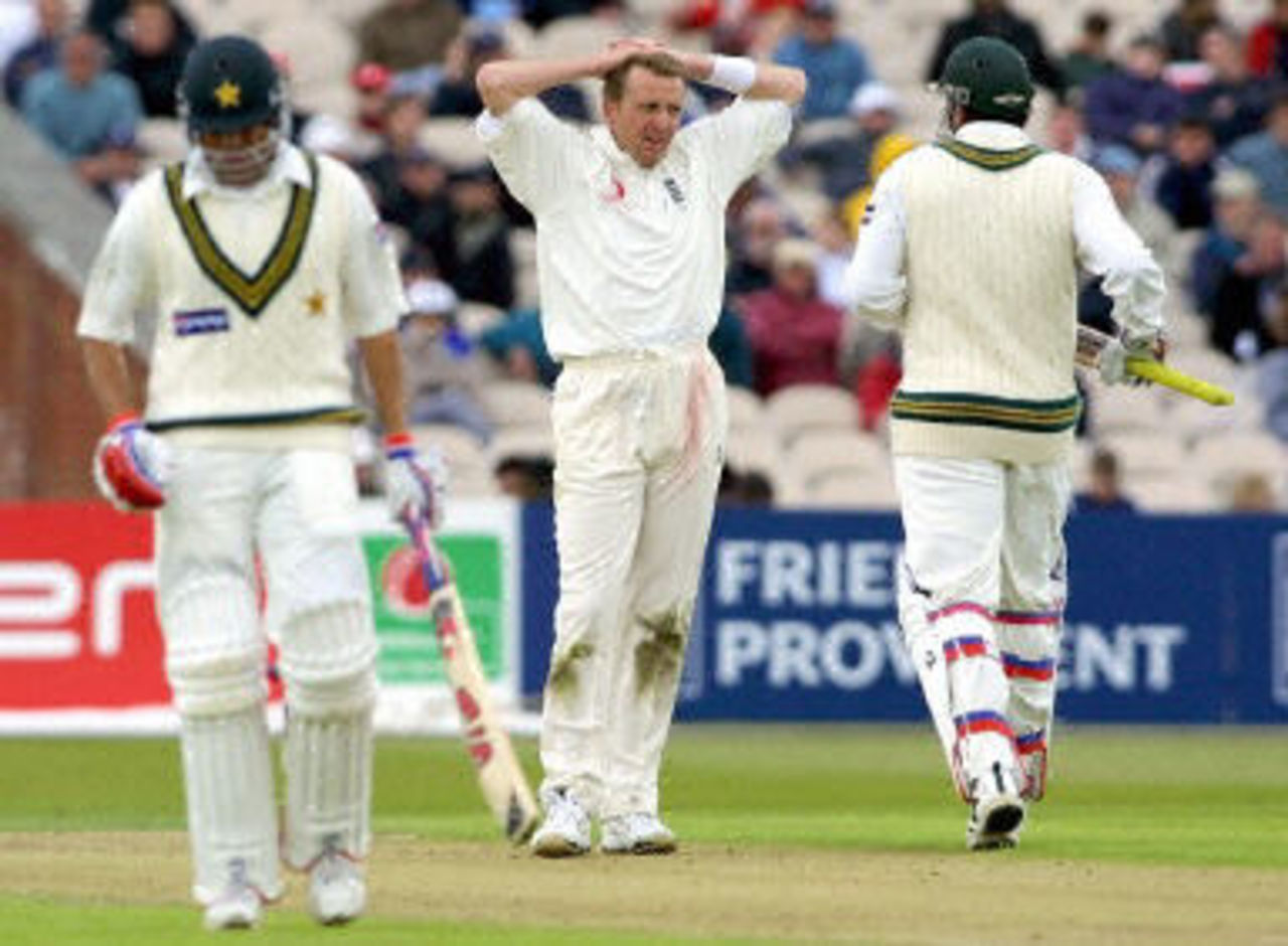 Cork watches Inzamam-ul-Haq and Younis Khan as they score runs, day 1, 2nd Test at Old Trafford, 31 May - 4 June 2001.