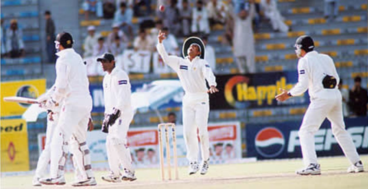 Daryl Tuffey is caught by a gleeful Younis Khan - New Zealand second innings, day 3, 1st Test, New Zealand v Pakistan, Gaddafi Stadium Lahore, 3 May 2002