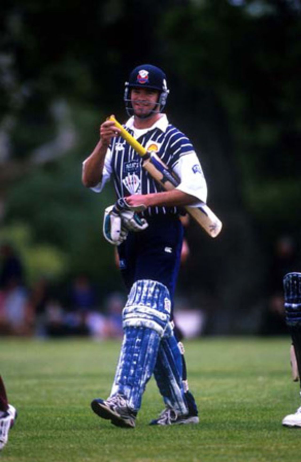 Auckland batsman Dion Nash leaves the field at the end of a Shell Cup innings in 1999/00.