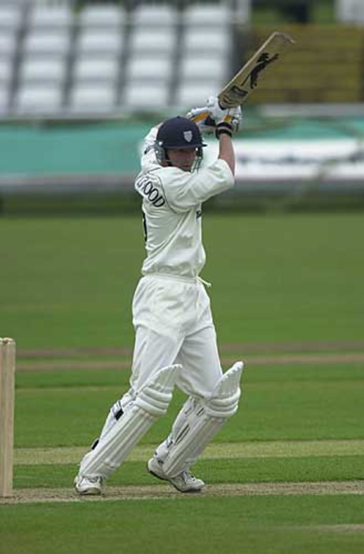 Durham's Paul Collingwood at the end of a lovely cover  drive for 4