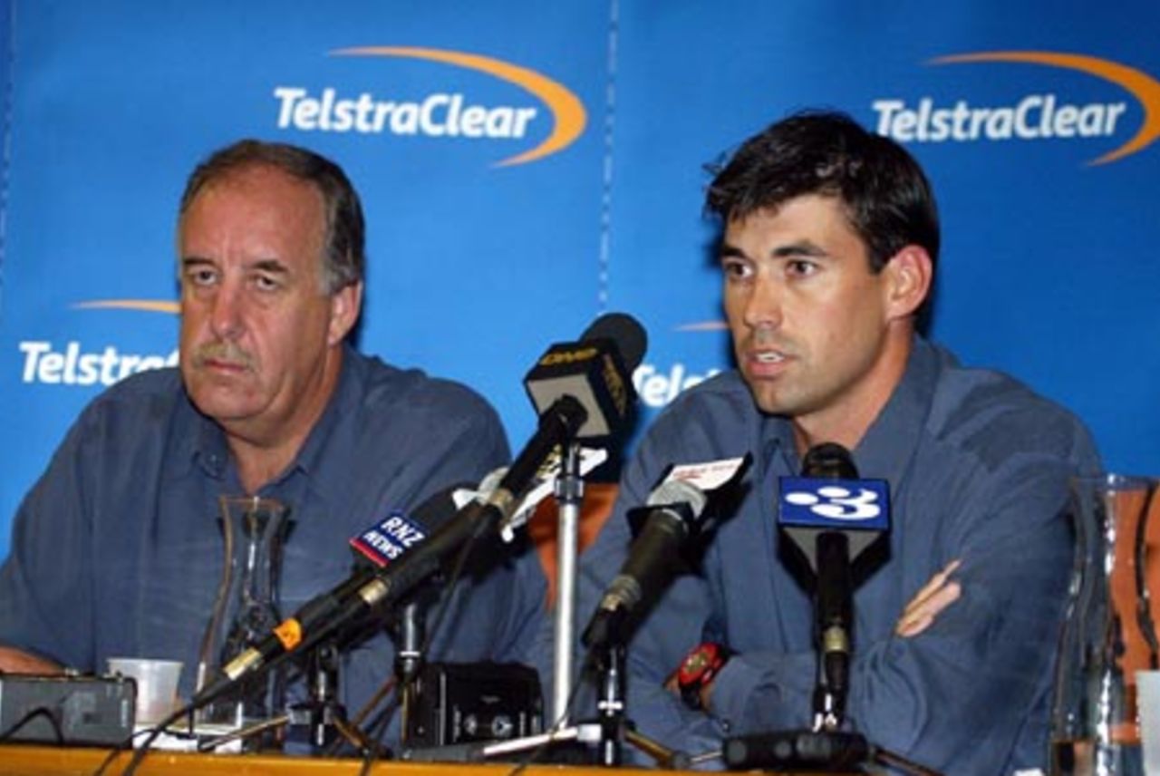 New Zealand captain Stephen Fleming (right) speaks at a press conference at Auckland Airport while coach Denis Aberhart looks on. The New Zealand team returned from Pakistan after a bomb blast outside their Karachi hotel caused the tour to be cancelled just prior to the second Test. 10 May 2002.