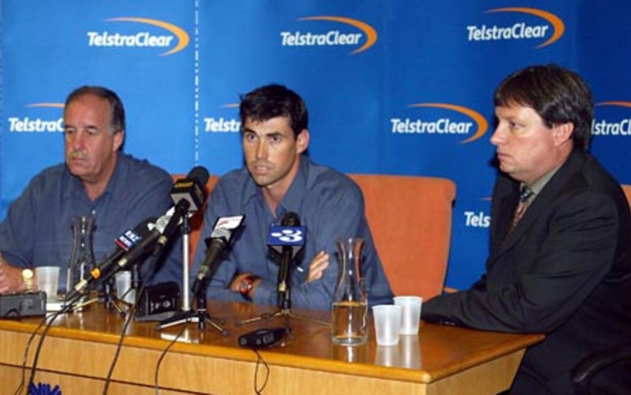 New Zealand captain Stephen Fleming (centre) speaks at a press conference at Auckland Airport while coach Denis Aberhart (left) and New Zealand Cricket chief executive Martin Snedden look on. The New Zealand team returned from Pakistan after a bomb blast outside their Karachi hotel caused the tour to be cancelled just prior to the second Test. 10 May 2002.