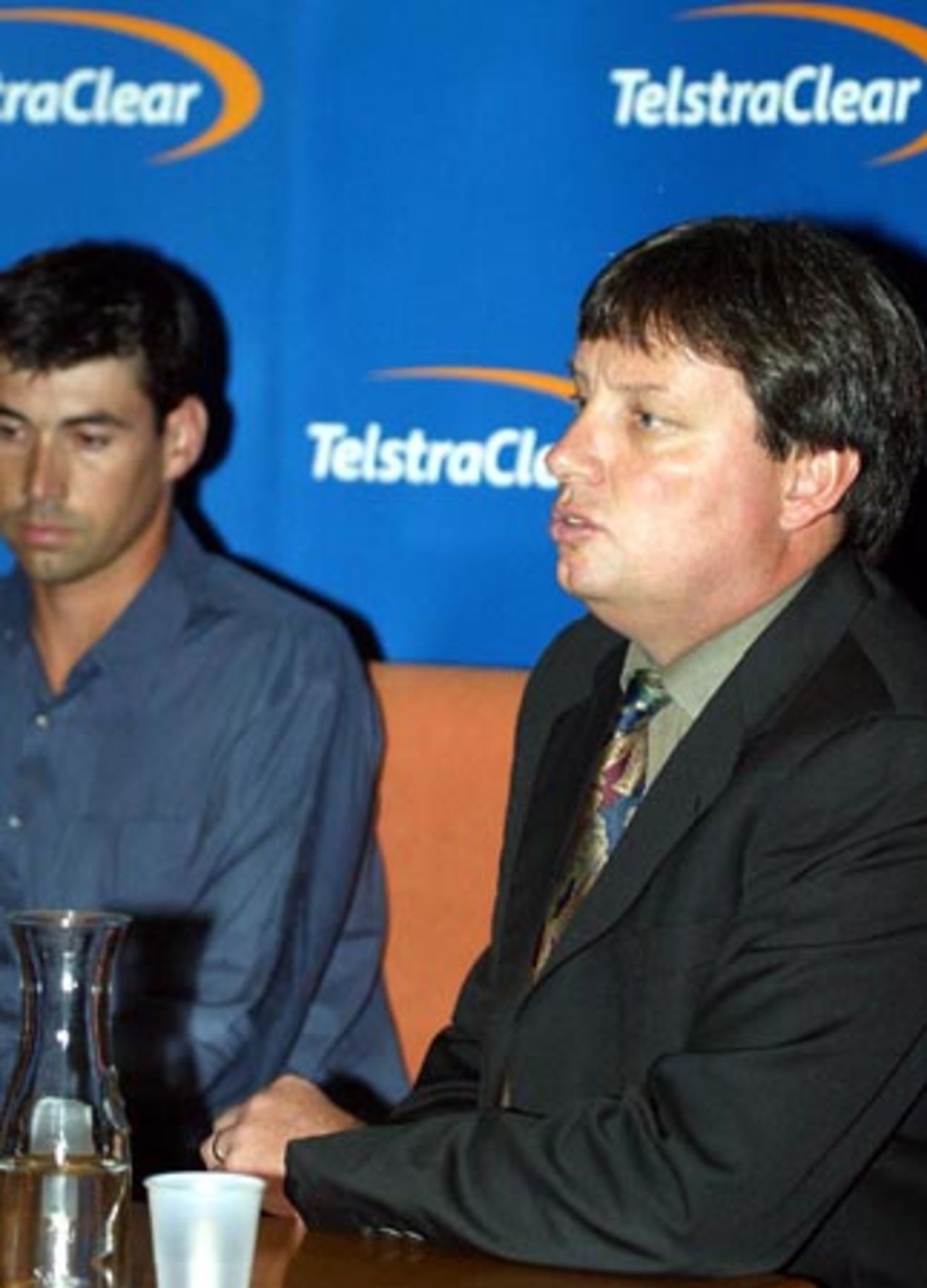 New Zealand Cricket chief executive Martin Snedden (right) speaks at a press conference at Auckland Airport while captain Stephen Fleming looks on. The New Zealand team returned from Pakistan after a bomb blast outside their Karachi hotel caused the tour to be cancelled just prior to the second Test. 10 May 2002.