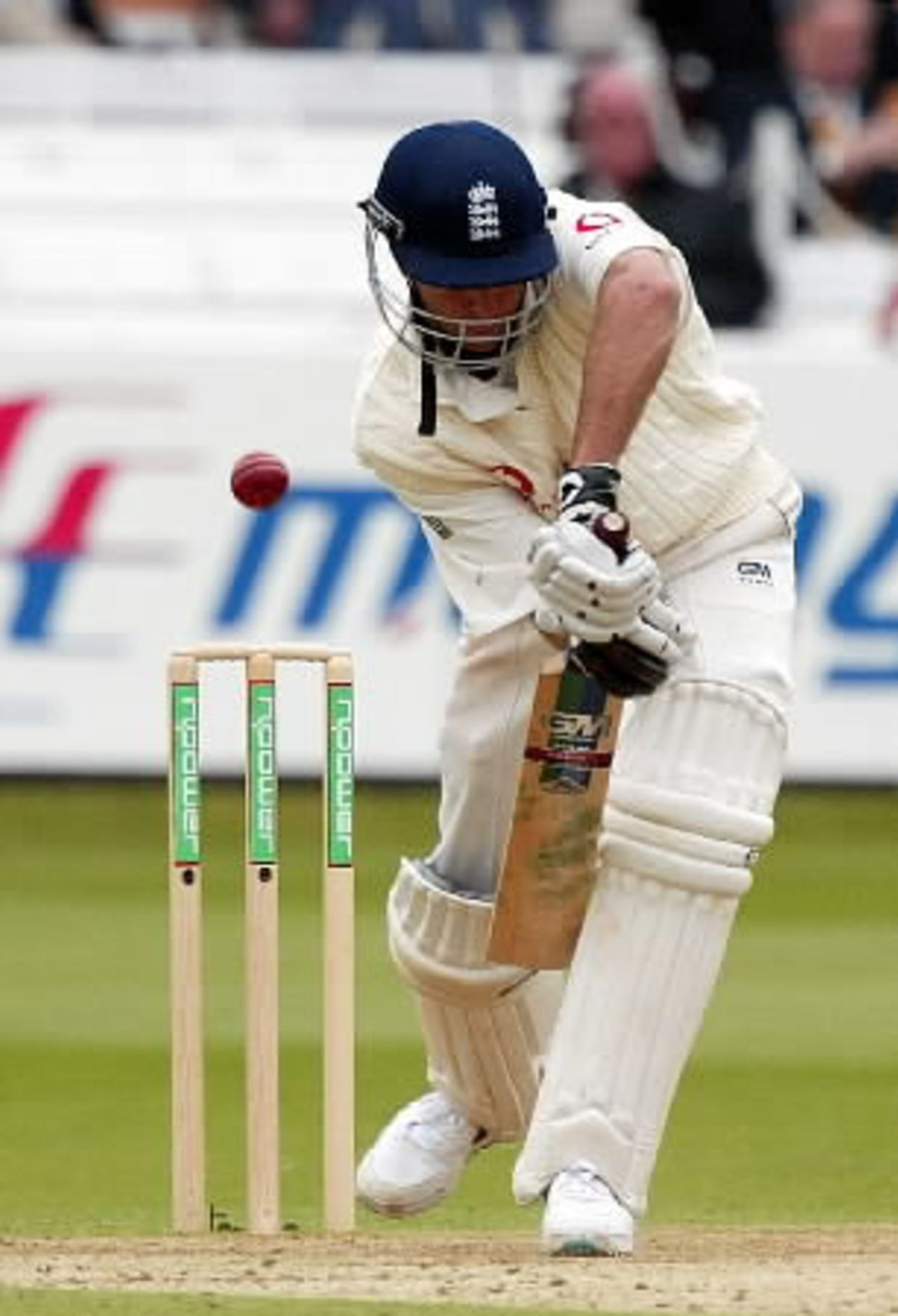 England Batsman Michael Vaughan plays a defensive stroke against a ball from Sri Lanka's left-arm fast bowler Ruchira Perera on the third day of the first test match at Lords, May 18, 2002