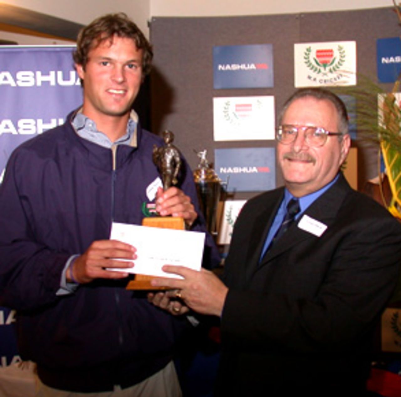 Nashua WP Young Player of the Season, Andrew Puttick receives his award from Arnold Bloch
