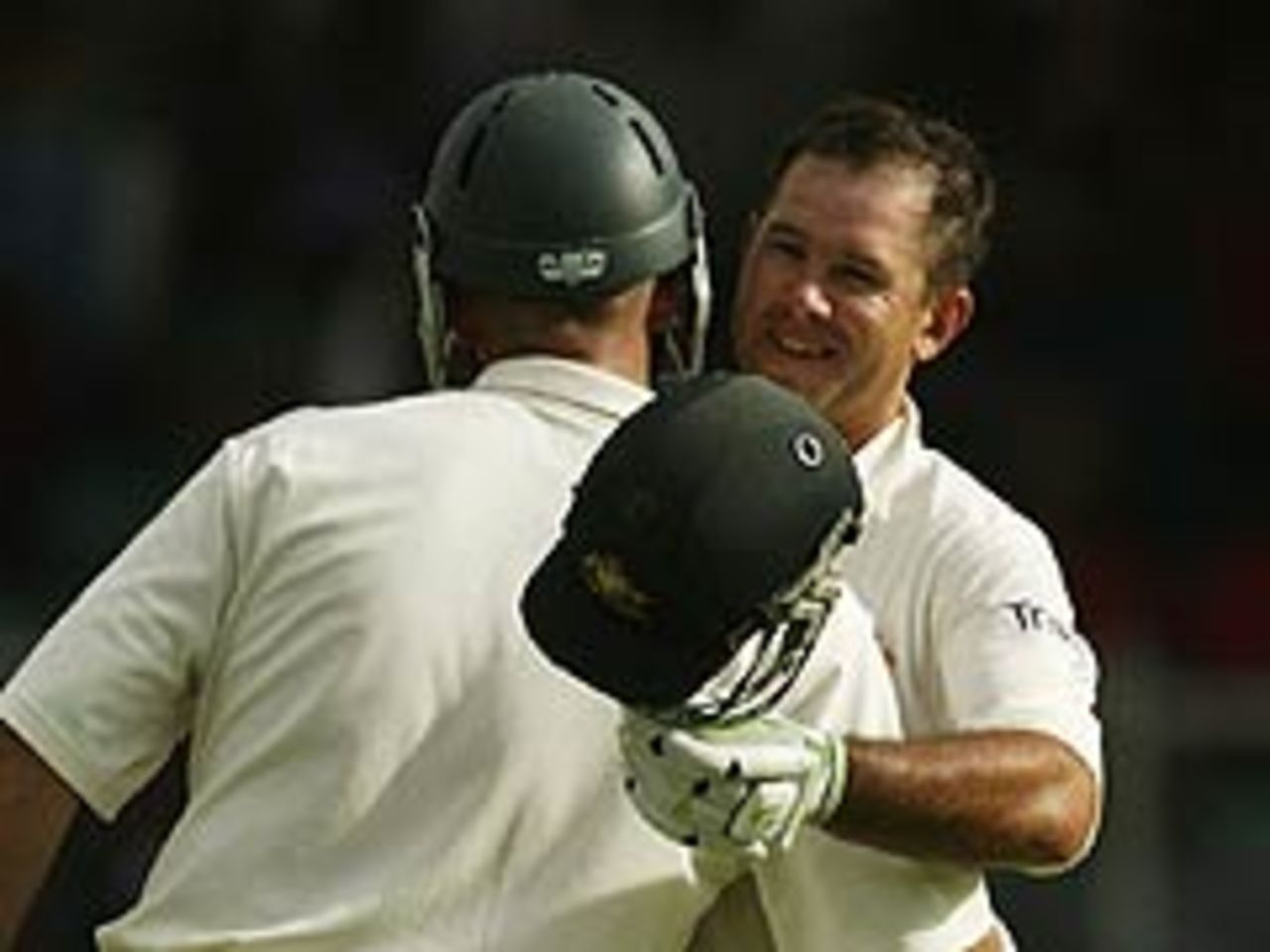 Ricky Ponting is congratulated on reaching his hundred on the first day of the third Test at Bridgetown, 1 May 2003