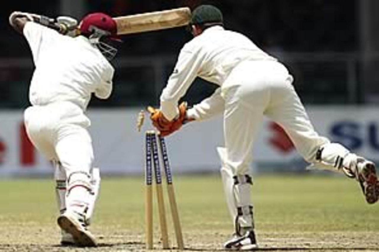 BRIDGETOWN - MAY 4: Jermaine Lawson of the West Indies is stumped by Adam Gilchrist of Australia during day four of the Third Test between the West Indies and Australia played at Kensington Oval on May 4, 2003 in Bridgetown, Barbados.