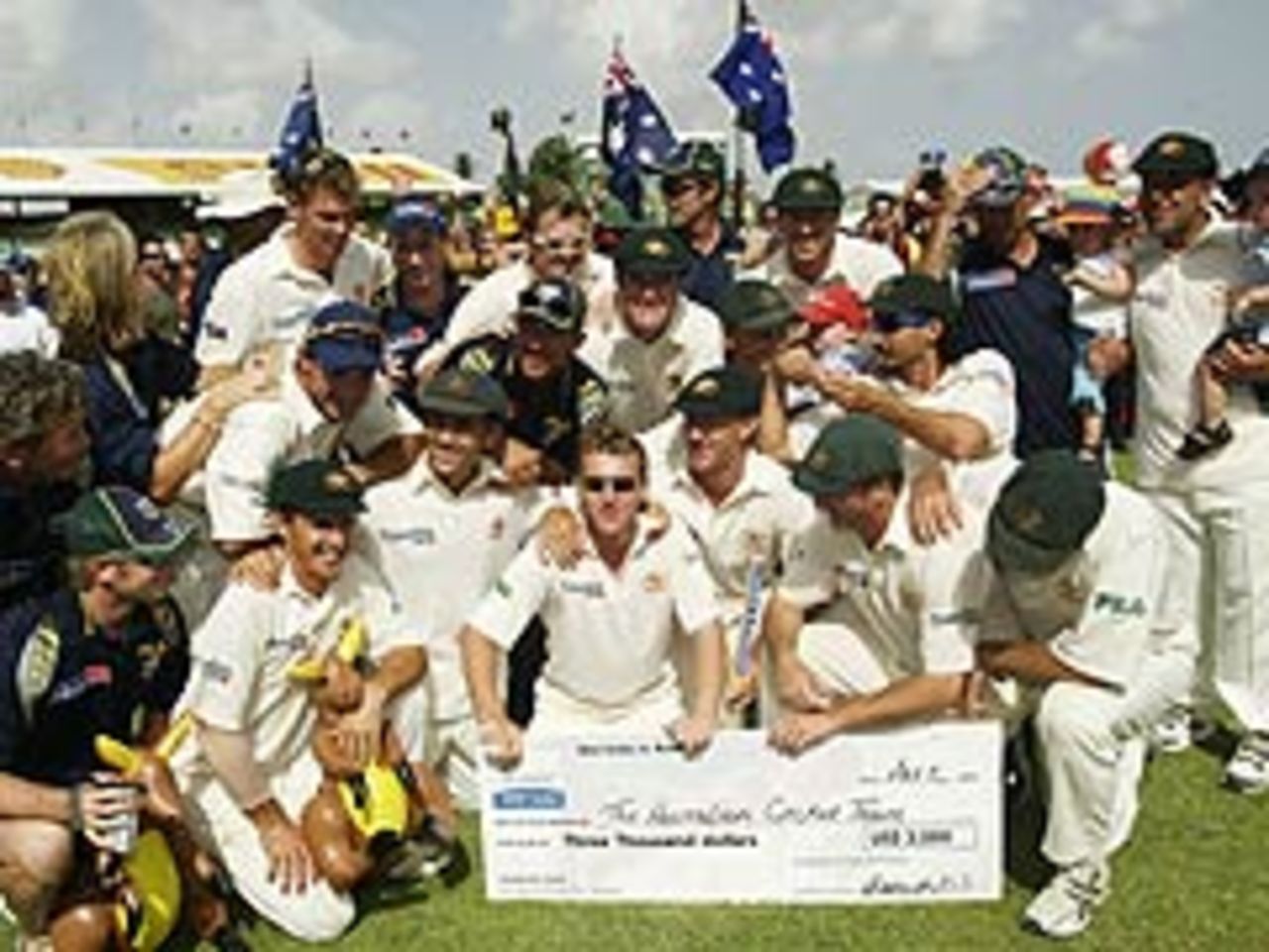 Australia celebrate following their nine-wicket win at Bridgetown (May 5 2003)