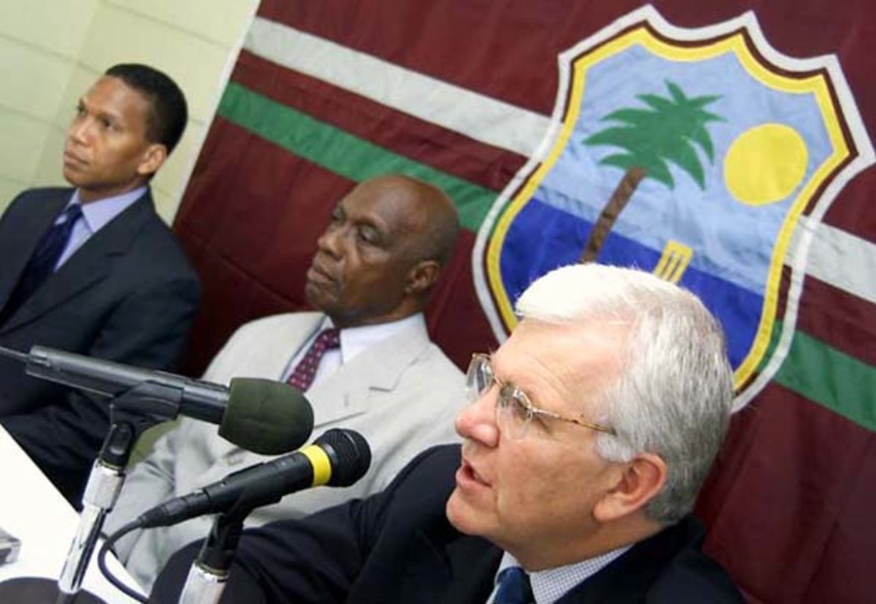 Malcolm Speed, Chief Executive Officer of the International Cricket Council, left, makes a point during a news conference at Kensington Oval, Also seated are (from left) Chris Dehring, Managing Director of Windies World Cup 2007 Inc., and Rev. Wes Hall, President of the West Indies Cricket Board.