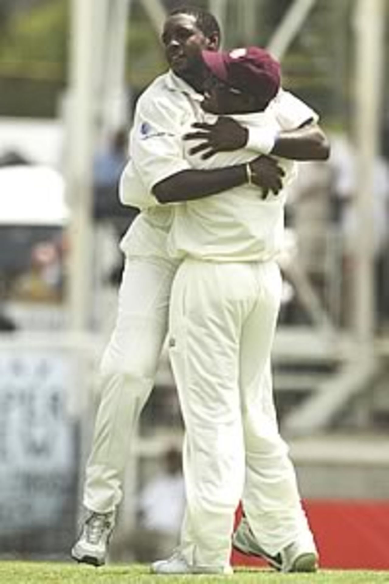 ST JOHN'S - MAY 9: Jermaine Lawson and Brian Lara of the West Indies celebrate the wicket of Matthew Hayden of Australia during day one of the fourth test between the West Indies and Australia on May 9, 2003 played at the Recreation Oval, St John's, Antigua.
