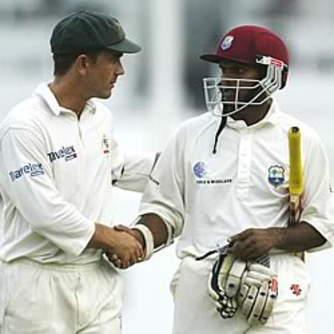 ST JOHN'S, ANTIGUA - MAY 12: Justin Langer of Australia congratulates Shivnarine Chanderpaul of the West Indies on his innings at the close of play during day four of the Fourth Test between the West Indies and Australia on May 12, 2003 at the Recreation Oval in St John's, Antigua.