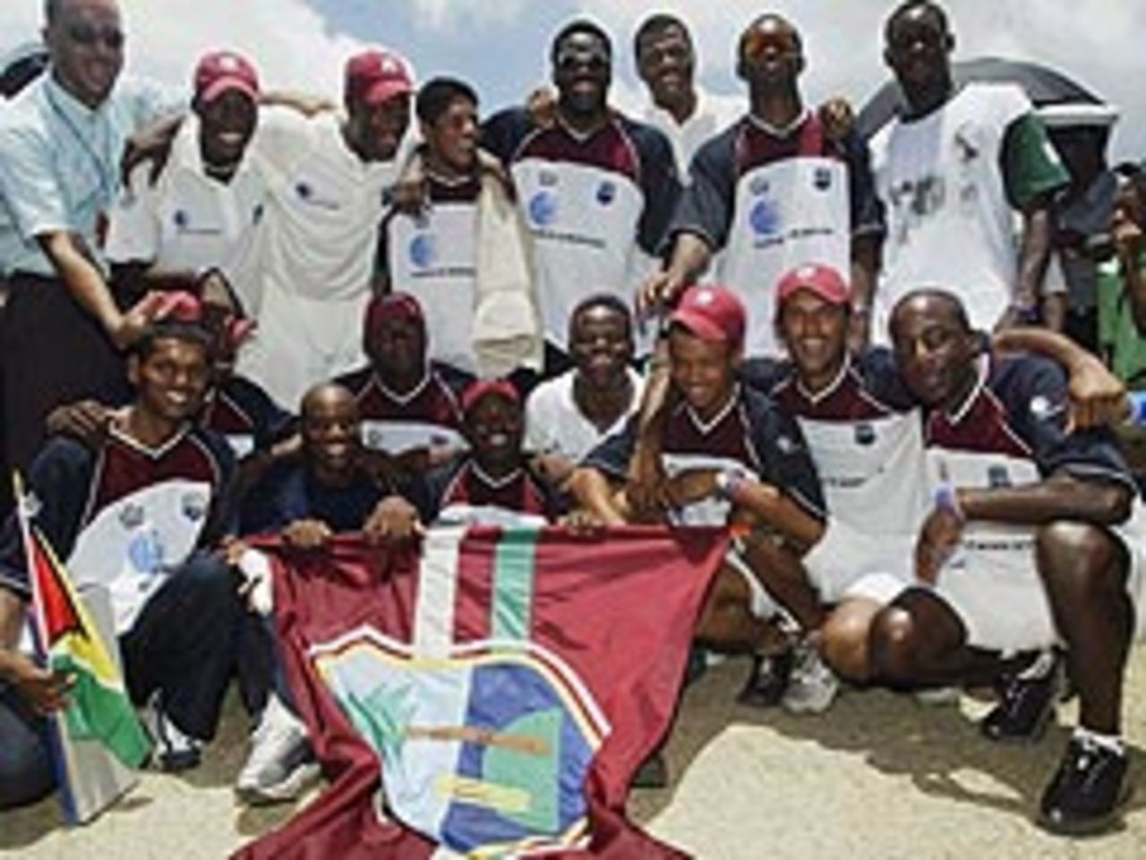 The West Indian team celebrates an historic victory