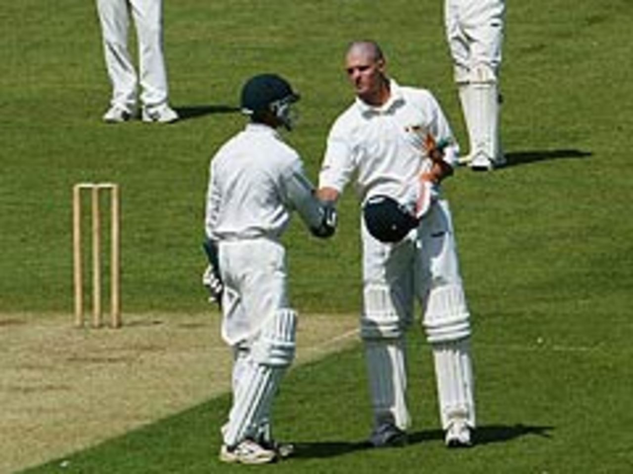 Mark Vermeulen is congratulated on reaching his hundred on the first day of Zimbabwe's tour match against Sussex at Hove (May 15 2003)