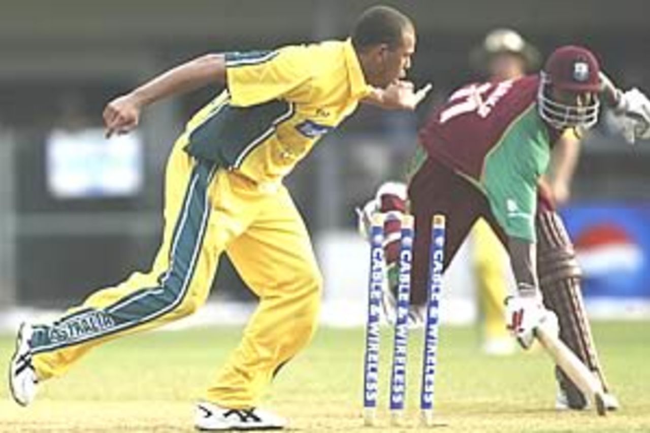 KINGSTON, JAMAICA - MAY 17: Andrew Symonds of Australia runs out Omari Banks of the West Indies during the 1st One Day International between the West Indies and Australia on May 17, 2003 at Sabina Park Kingston, Jamaica.
