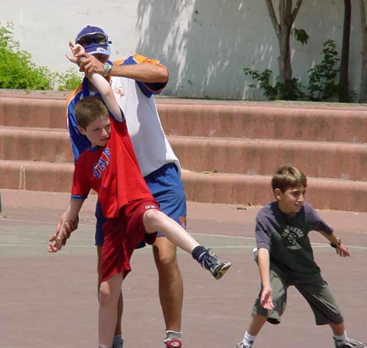 Getting the bowling action just right., May 2003